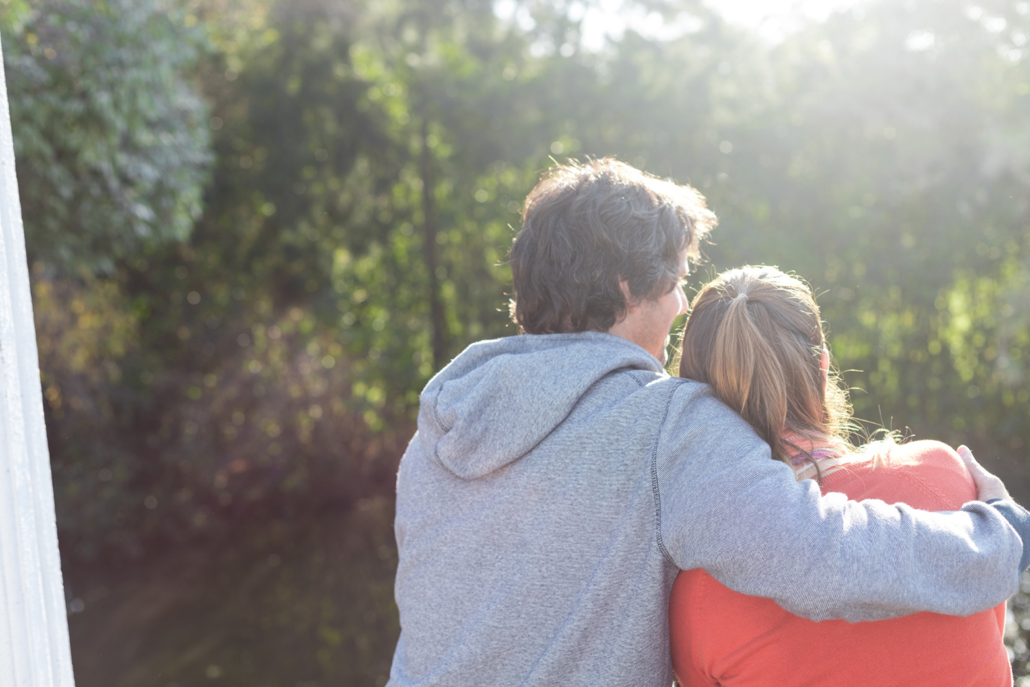 A couple enjoying the sunset from their porch | Source: Freepik