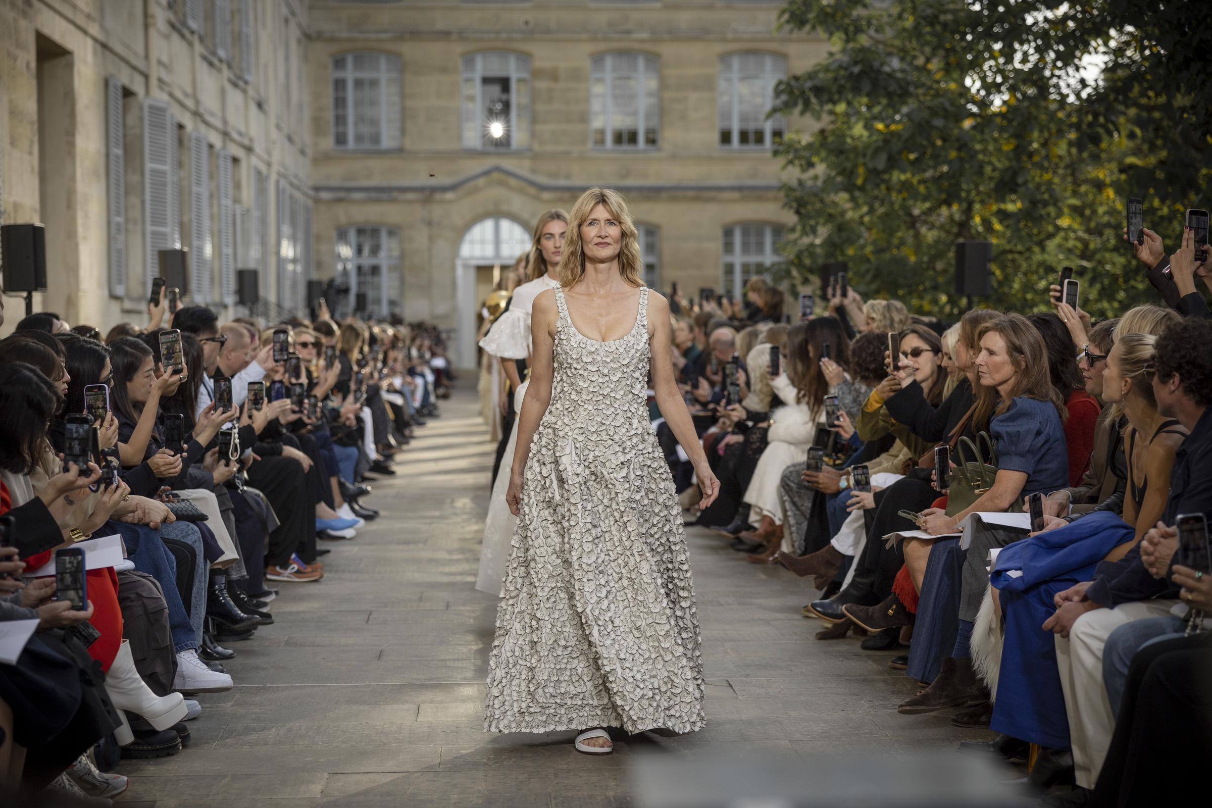 Laura Dern walks the runway at the end of the Gabriela Hearst Womenswear Spring/Summer 2026 show as part of Paris Fashion Week on October 01, 2025 in Paris, France. | Source: Getty Images