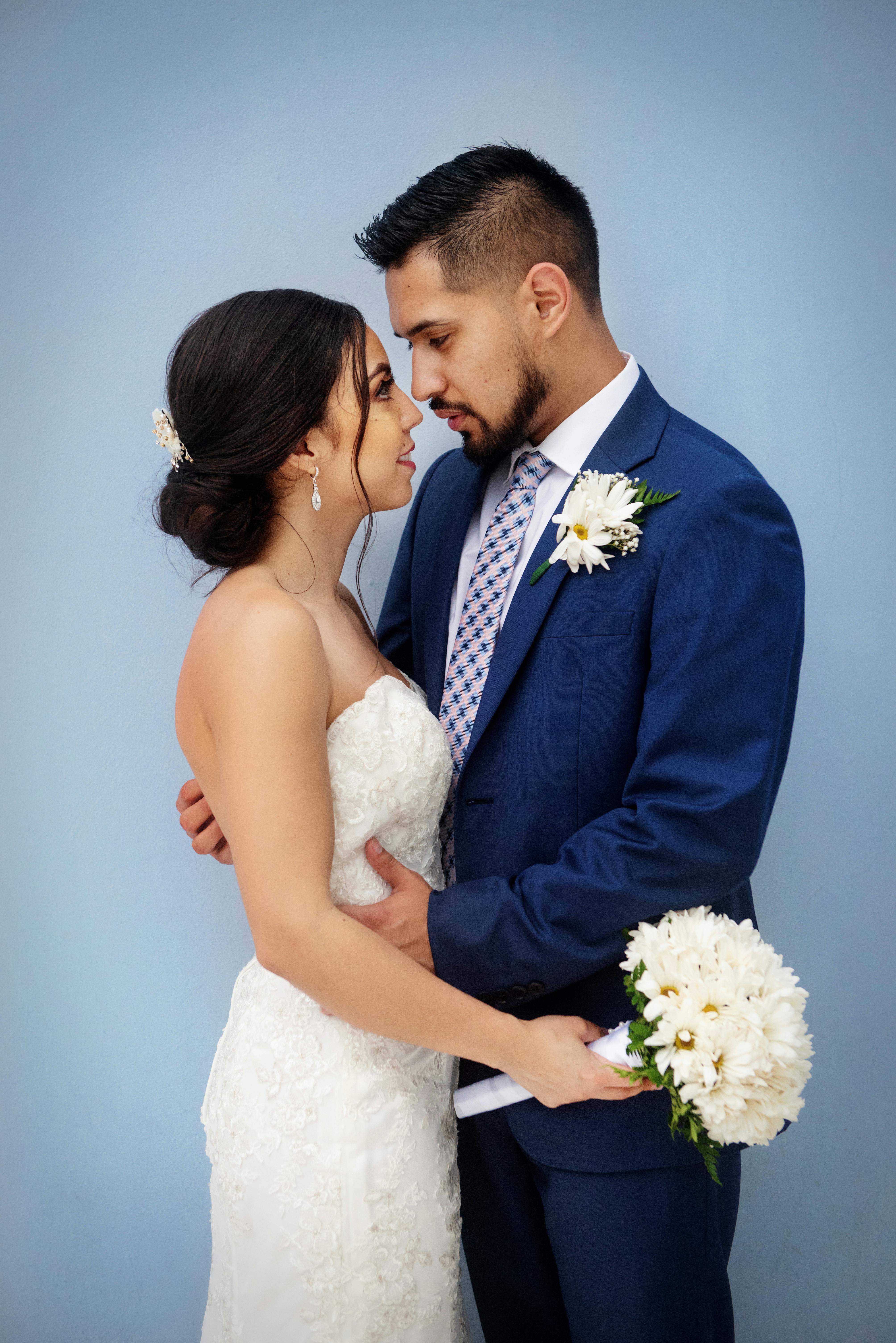 A happy bride and groom looking at each other | Source: Pexels