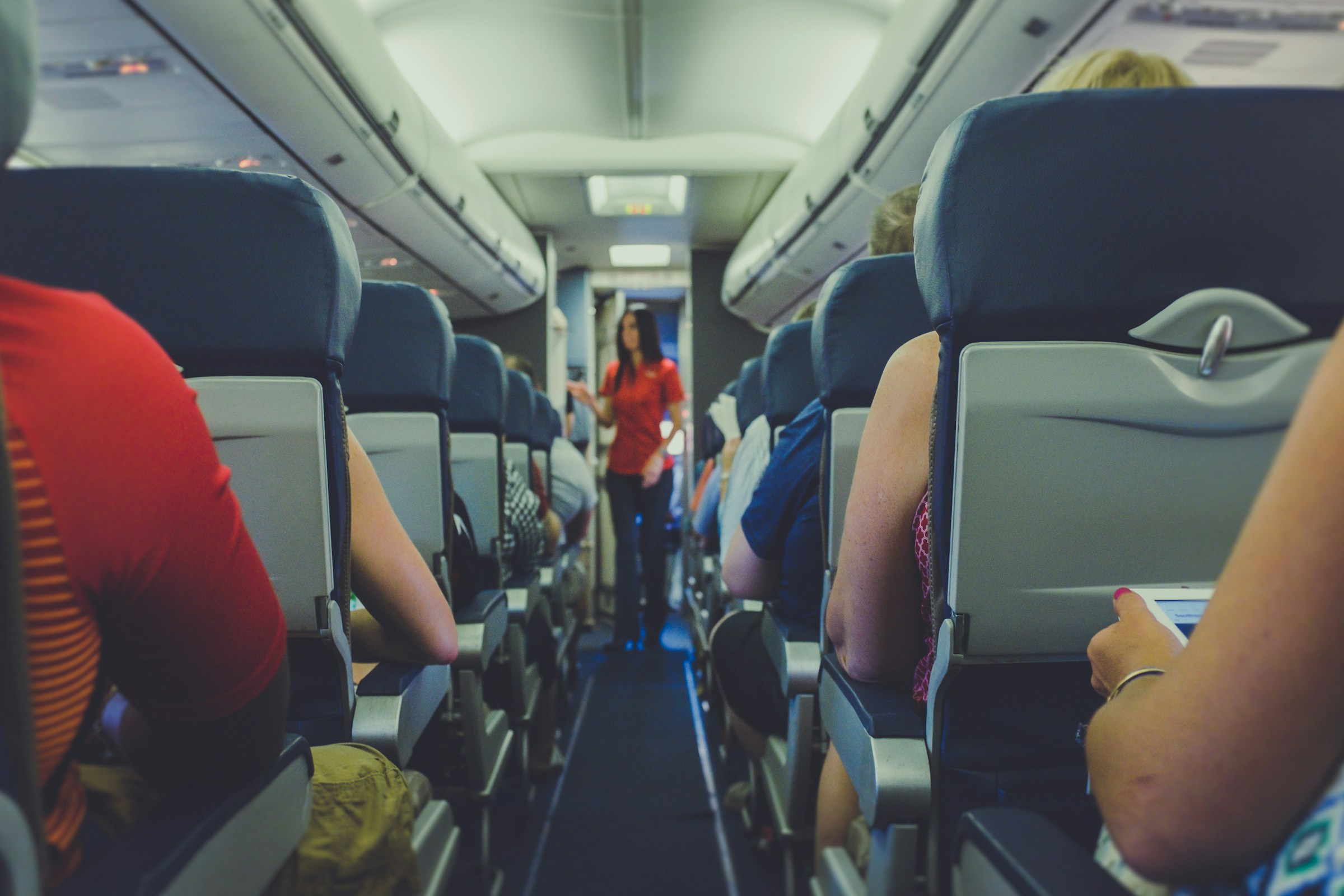 A flight attendant on a plane | Source: Unsplash