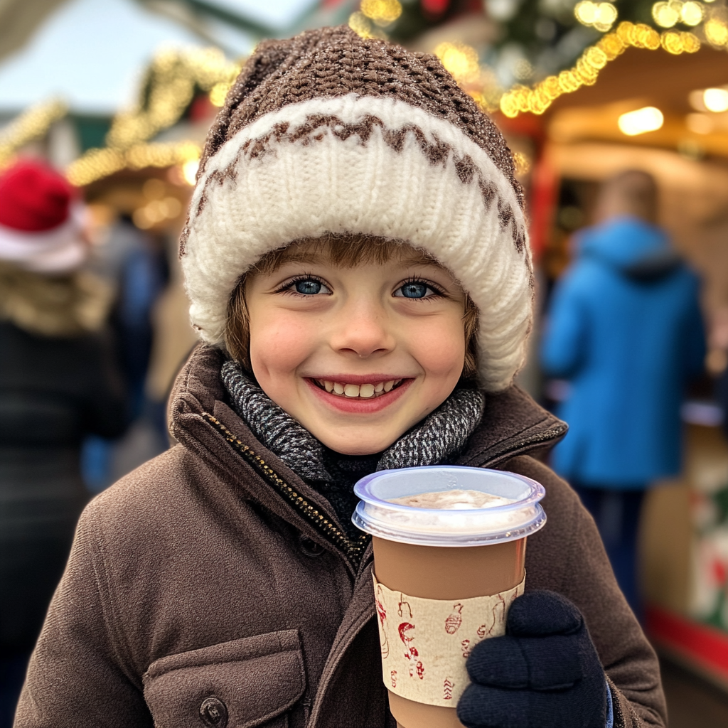 A happy boy holding hot chocolate | Source: Midjourney