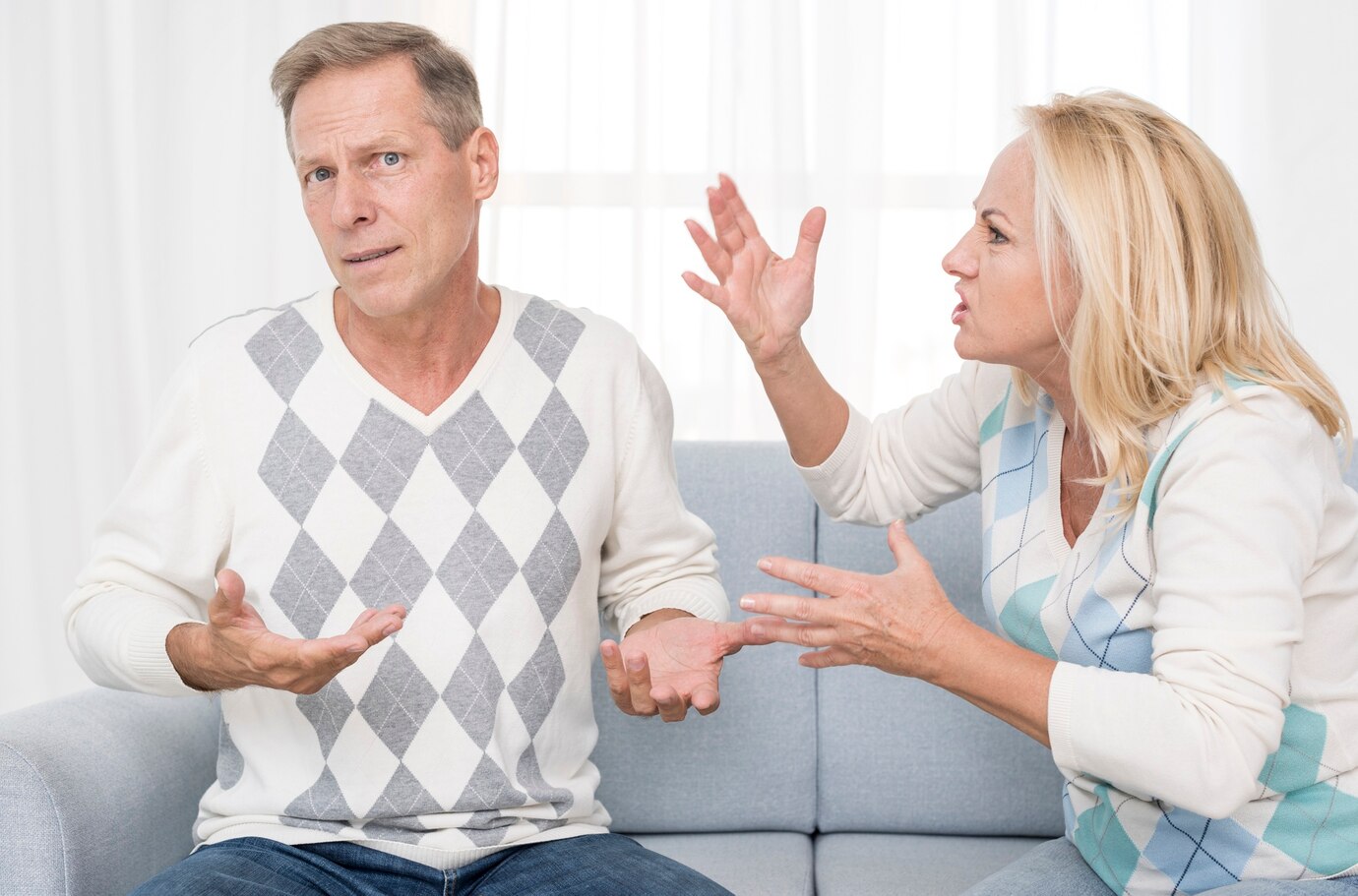 A mature couple arguing | Source: Freepik