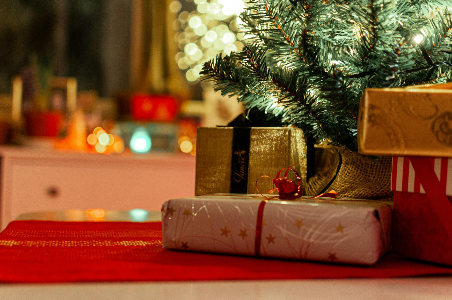 Christmas gifts under a tree | Source: Pexels