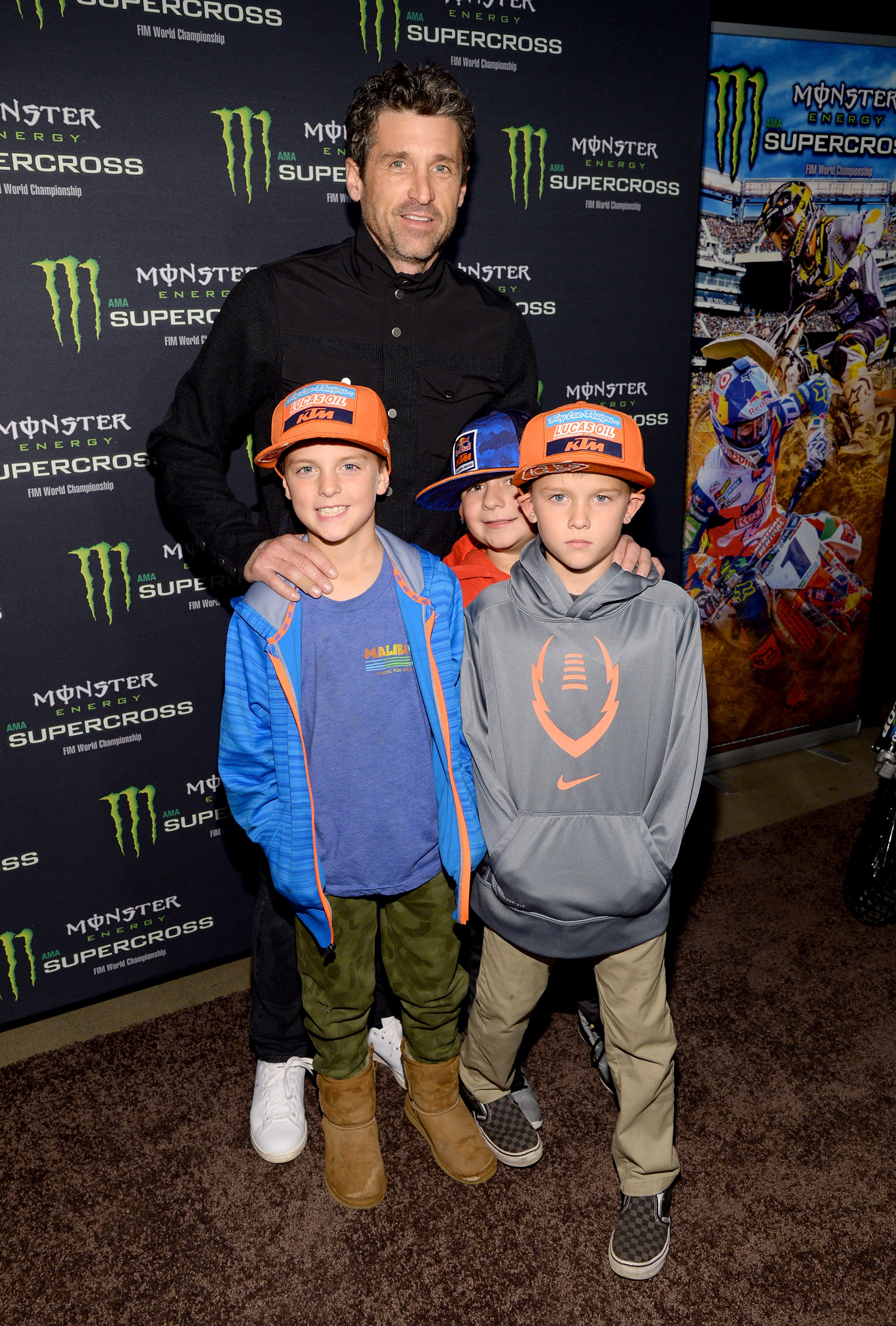 Patrick Dempsey with his sons, Darby Dempsey and Sullivan Dempsey, at the Monster Energy Supercross Celebrity Night on January 23, 2016, in Anaheim, California. | Source: Getty Images
