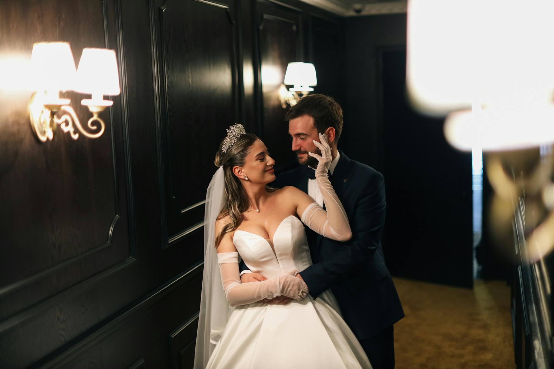A delighted bride and groom embracing each other | Source: Pexels