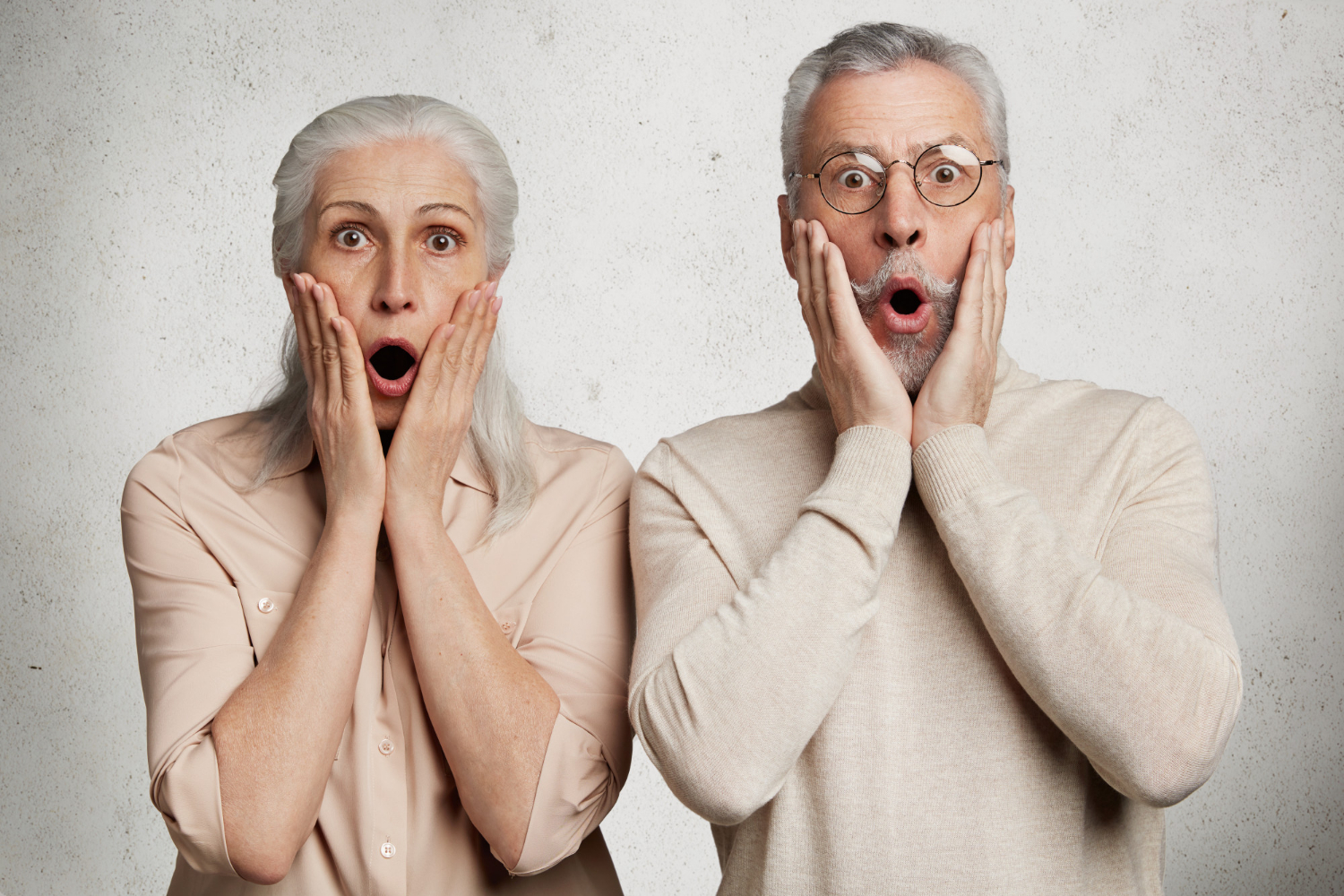 A surprised senior couple | Source: Freepik