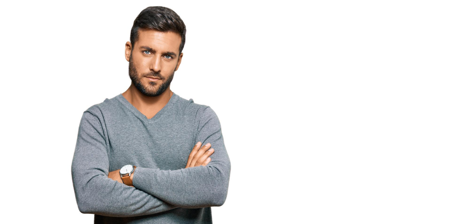 A confident man with his arms crossed | Source: Freepik