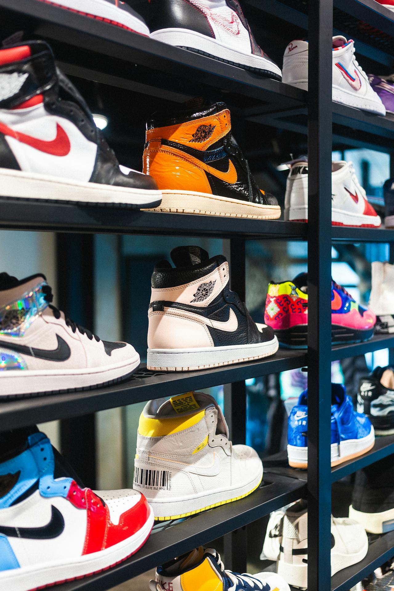 Branded sneakers on a store display | Source: Pexels