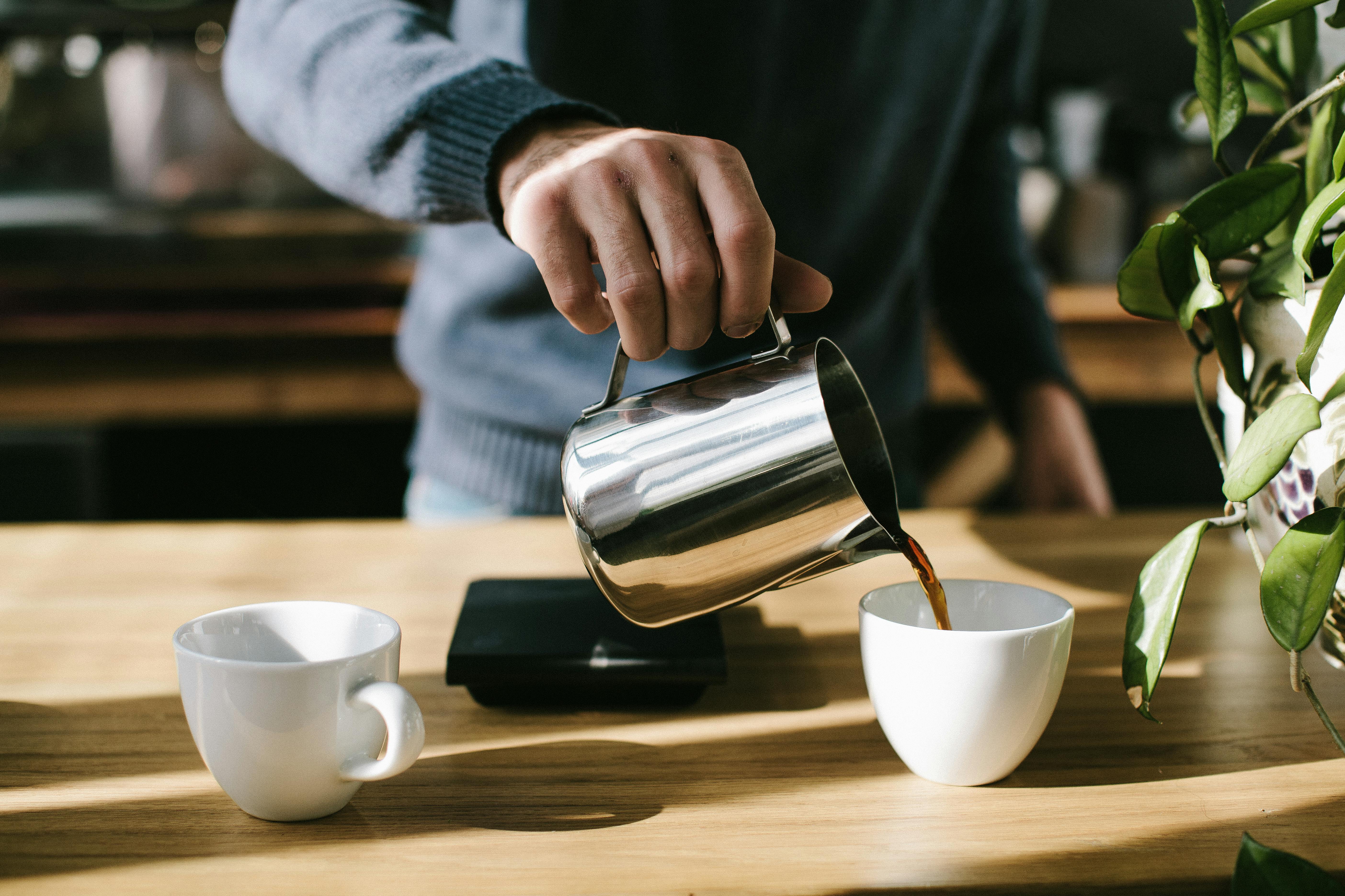A person pouring coffee | Source: Pexels