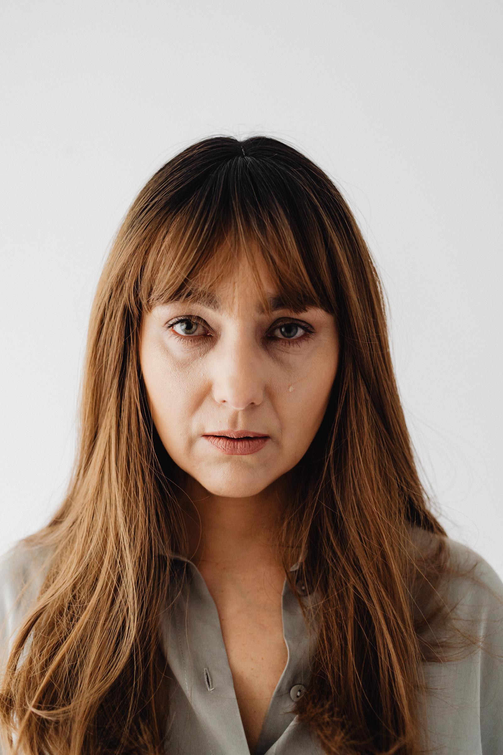 A woman looking serious and emotionally overwhelmed | Source: Pexels