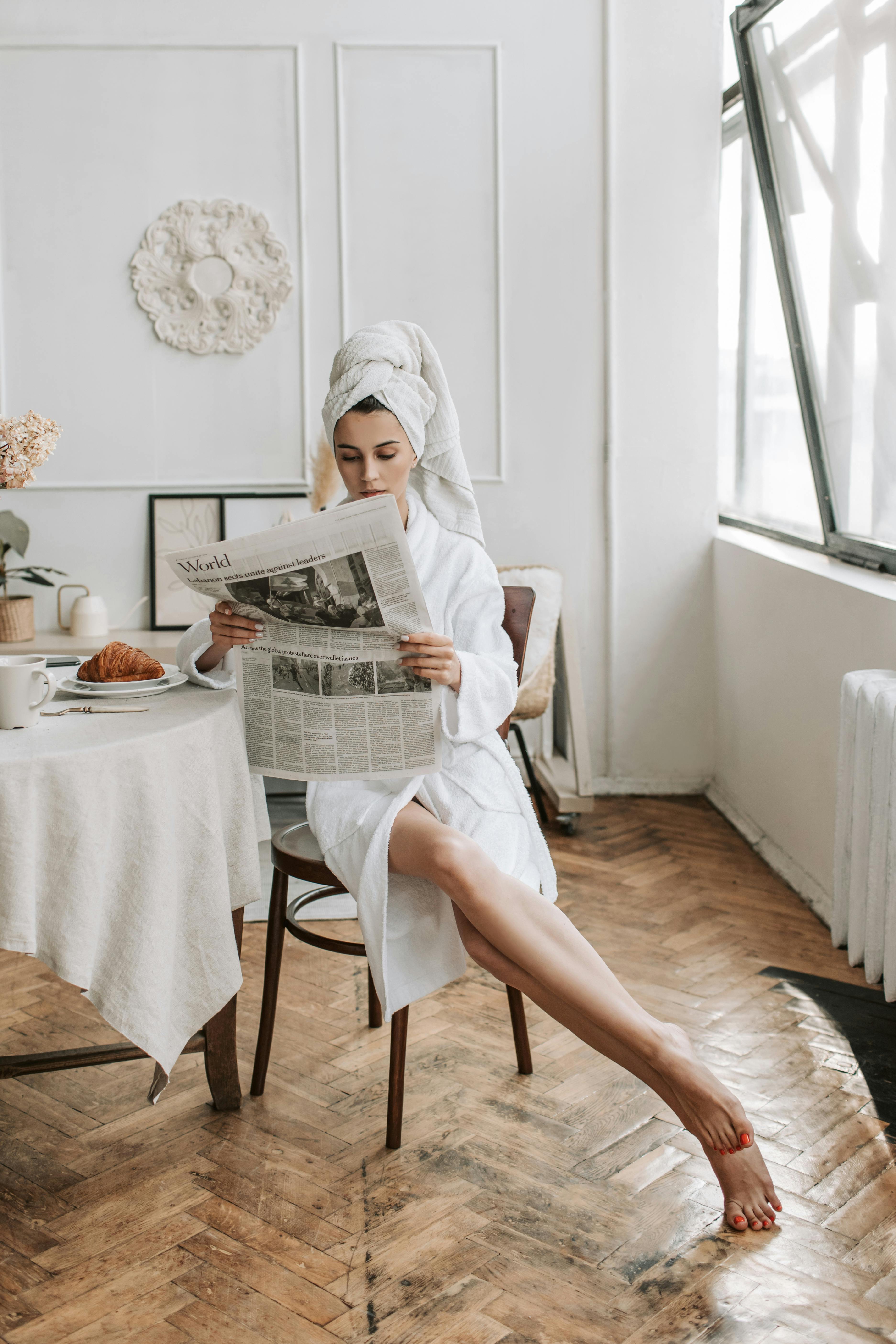 A woman lounging in a bathrobe | Source: Pexels