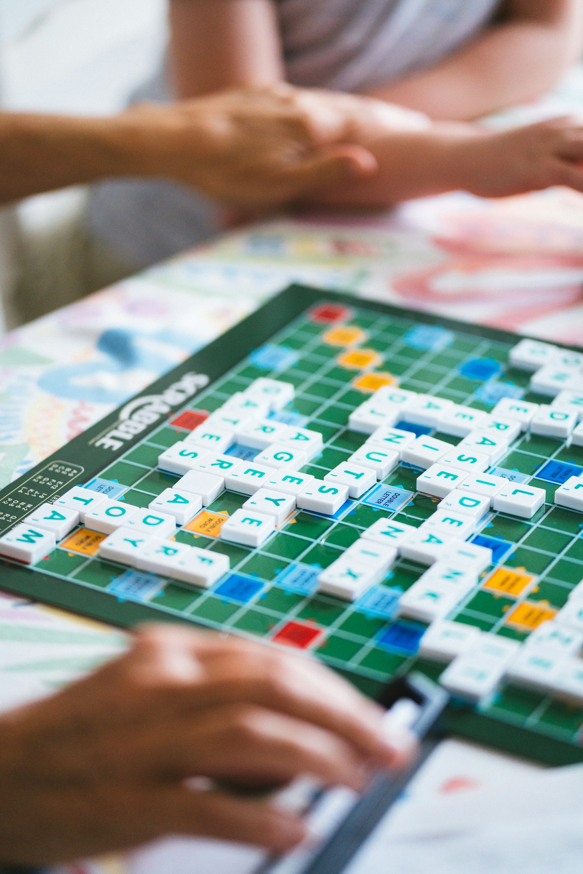A close-up shot of people playing Scrabble | Source: Unsplash