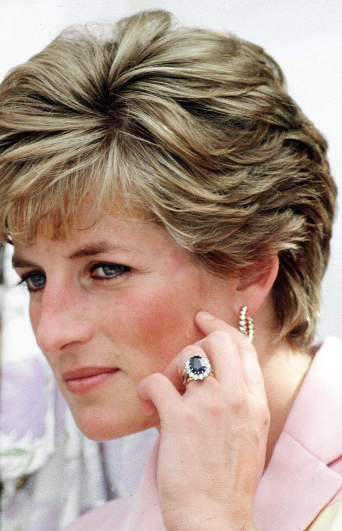 Diana, Princess of Wales' engagement ring, wedding ring, watch and gold earrings on April 25, 1991. | Source: Getty Images