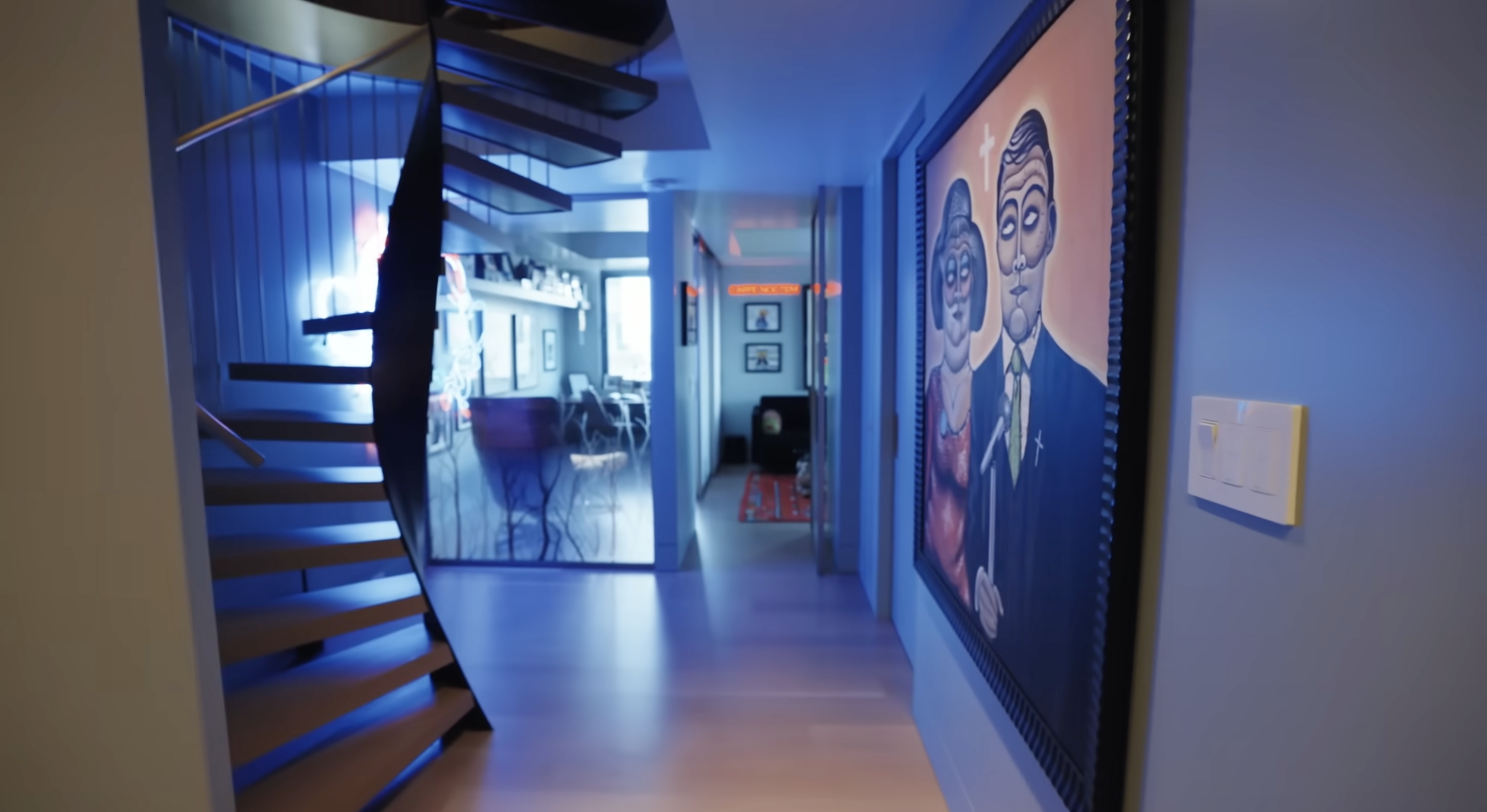 The view from the lower floor staircase at Christopher Meloni's apartment | Source: YouTube/Architectural Digest