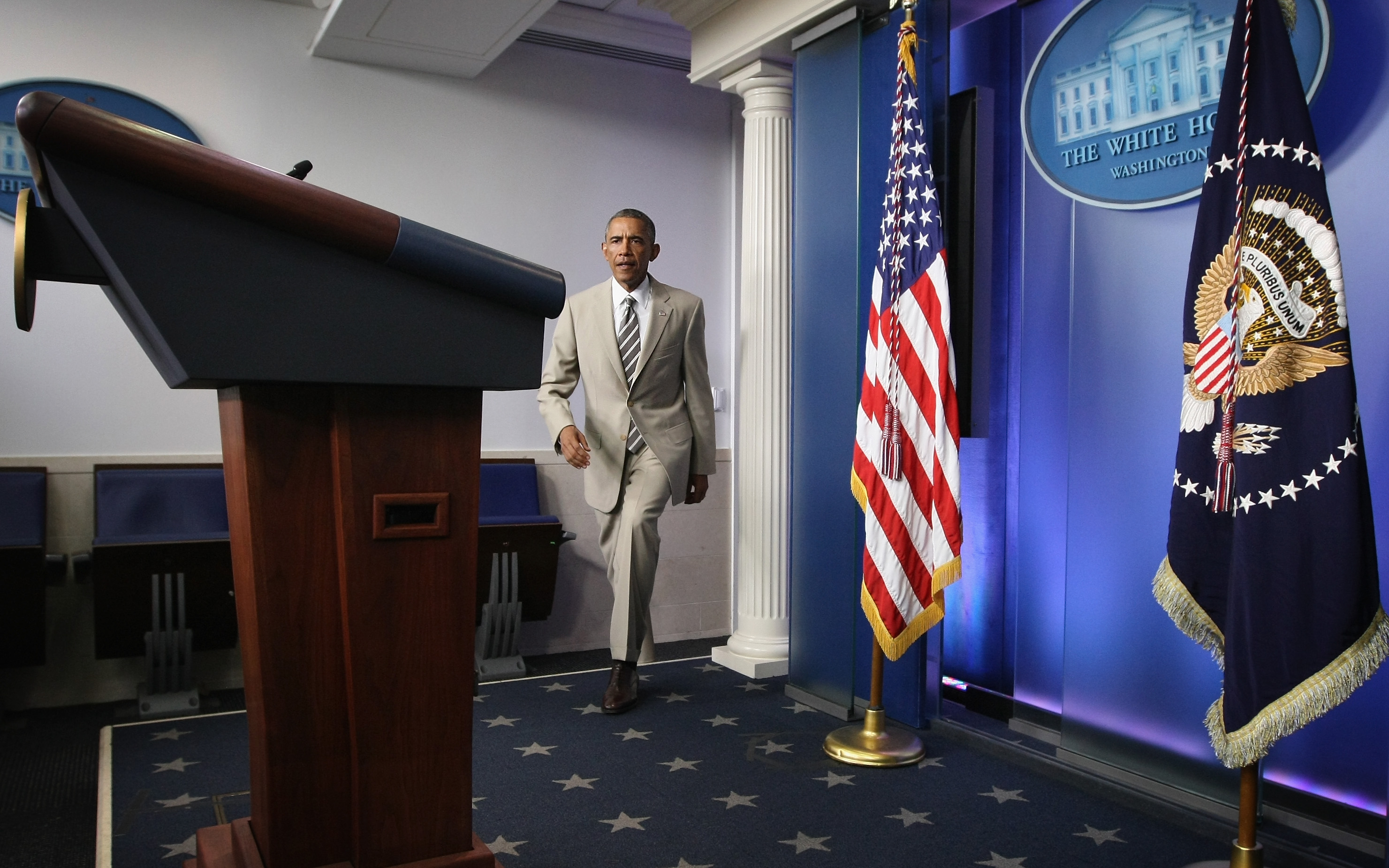 Barack Obama approaches the podium to make a statement at the James Brady Press Briefing Room of the White House August 28, 2014, in Washington, DC. | Source: Getty Images