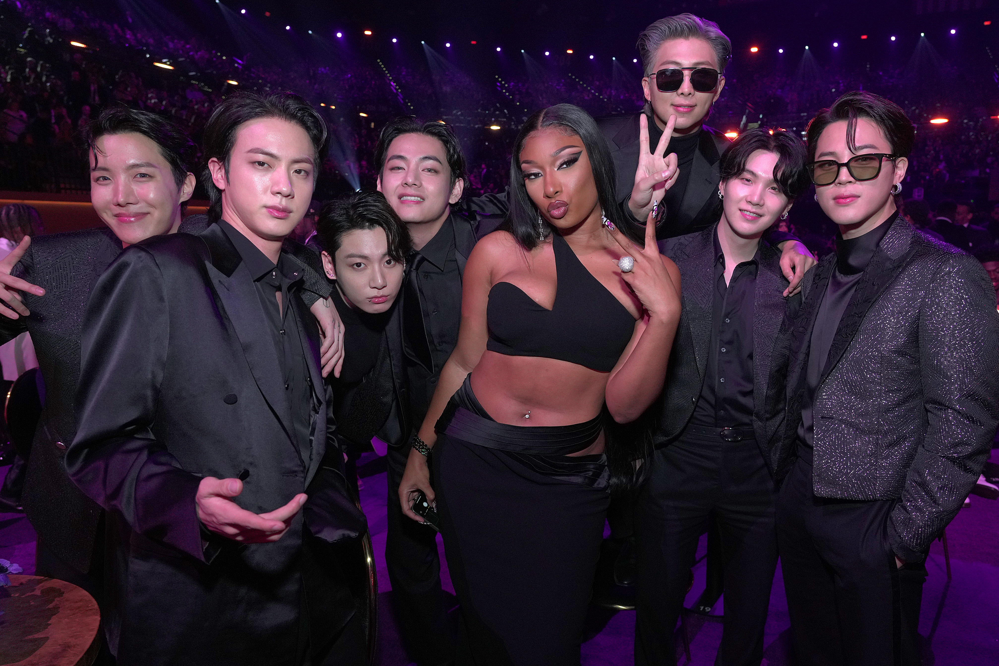 J-Hope, Jin, Jungkook, V, Megan Thee Stallion, RM, Suga, and Jimin pose during the 64th Annual GRAMMY Awards at MGM Grand Garden Arena on April 03, 2022 in Las Vegas, Nevada. | Source: Getty Images