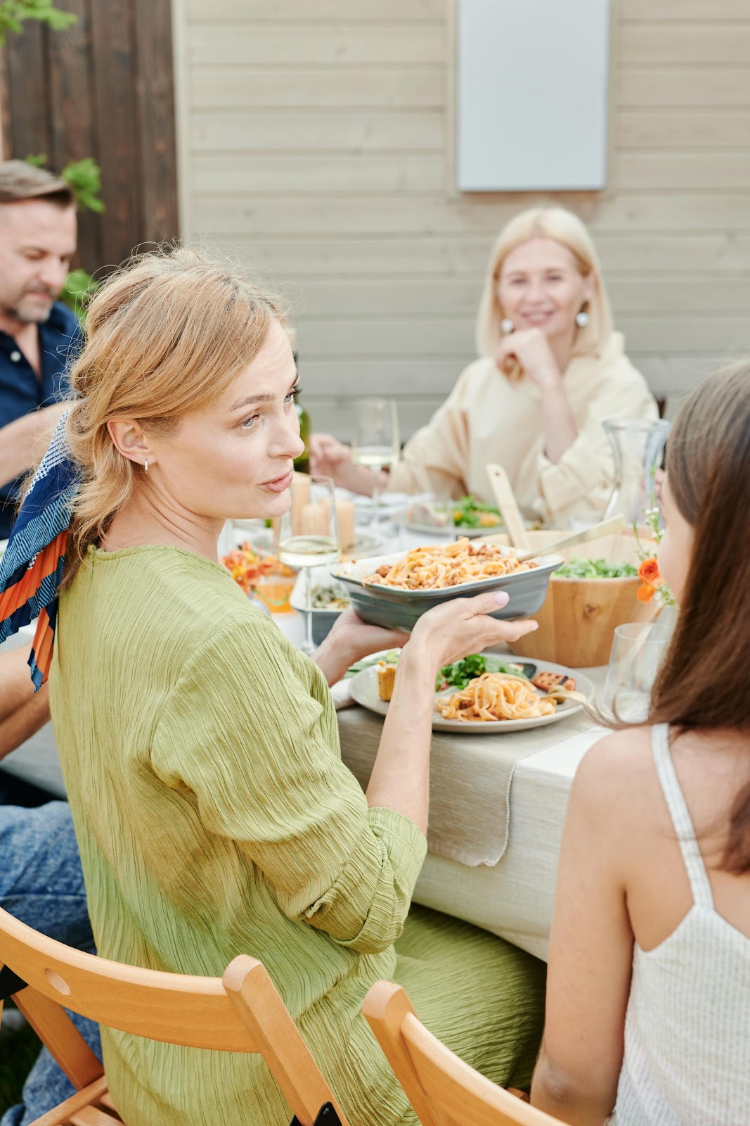 Women talking during a family dinner | Source: Pexels