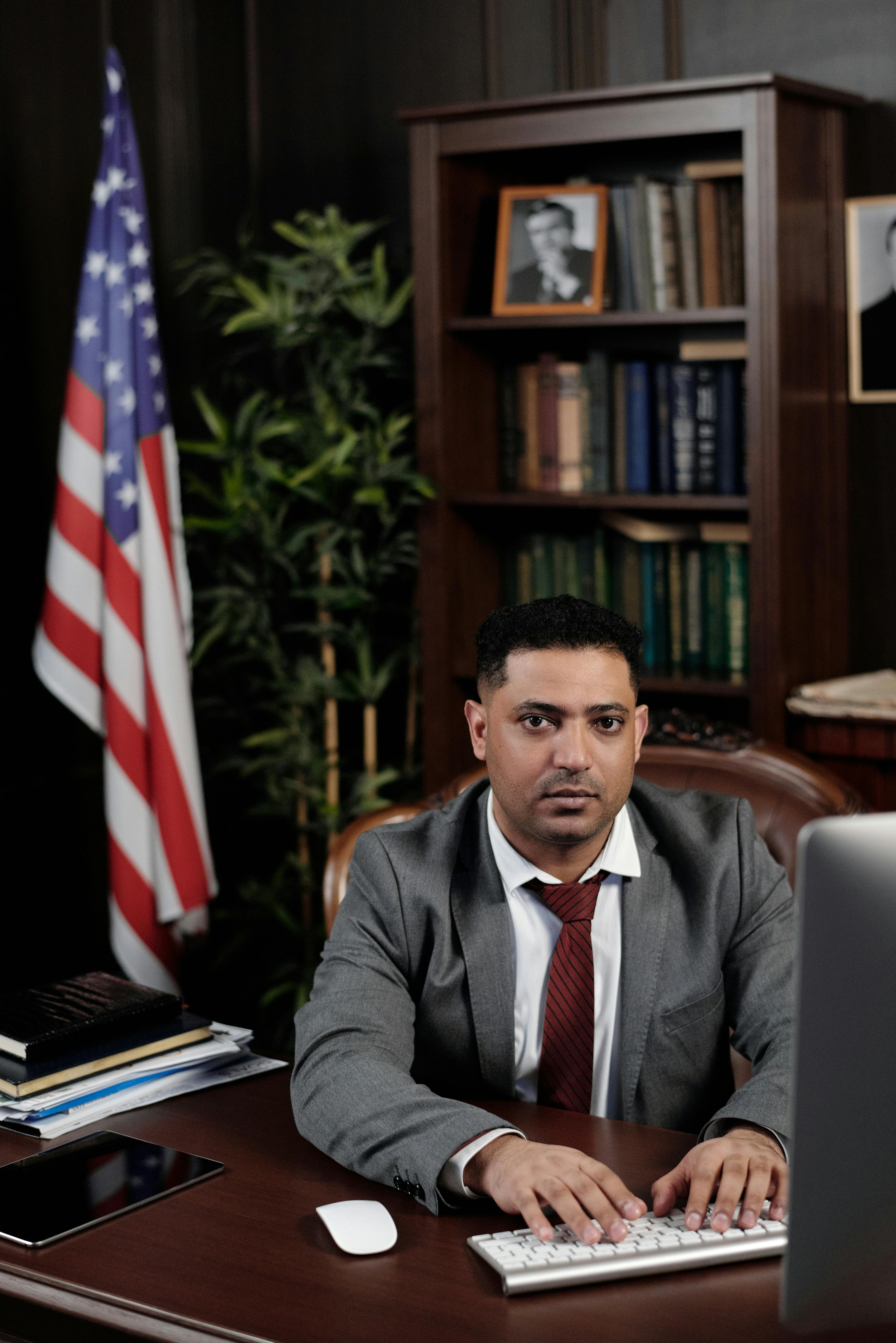 Lawyer typing on his computer | Source: Pexels