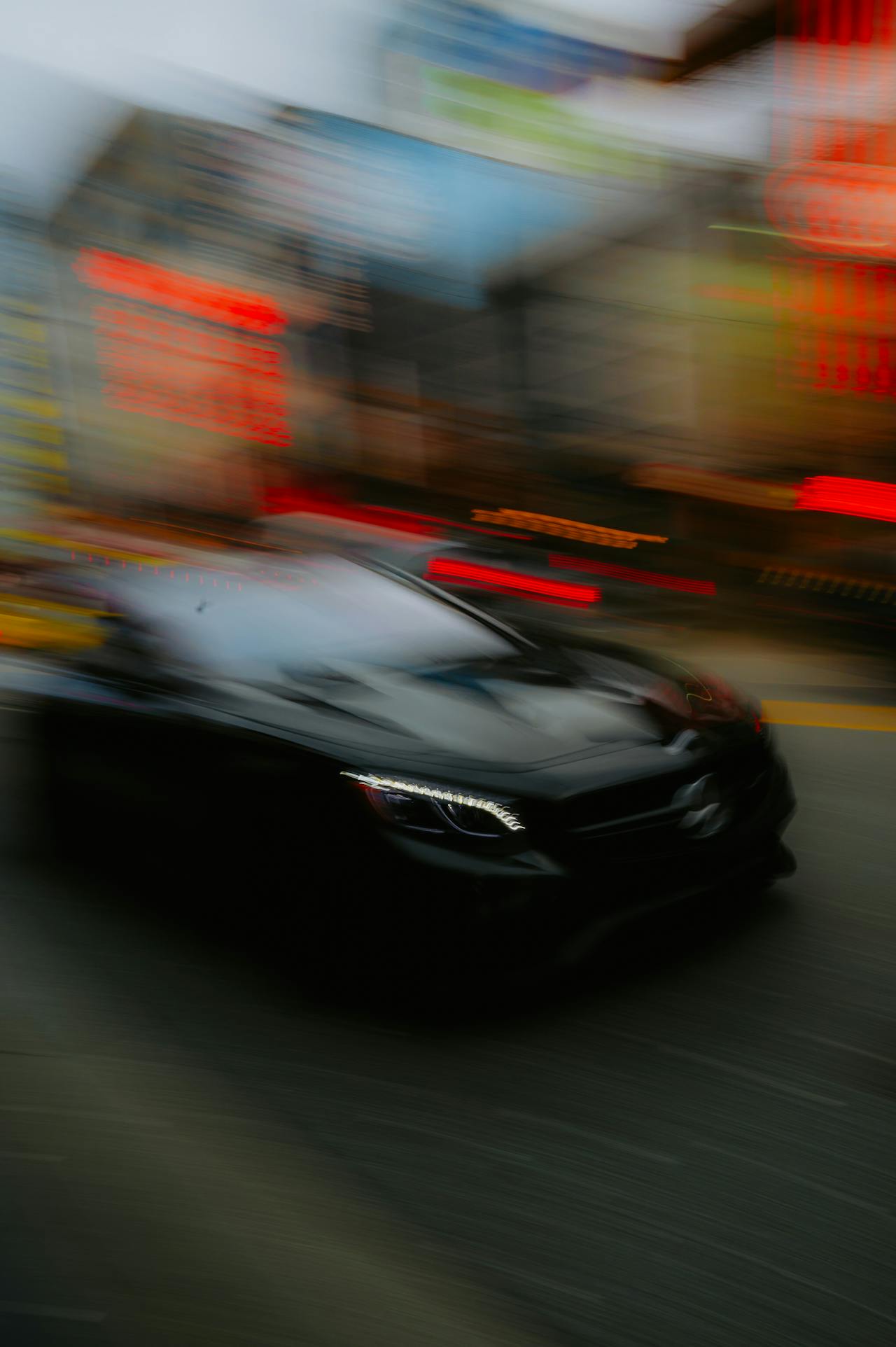 Blurry image of a speeding car | Source: Pexels