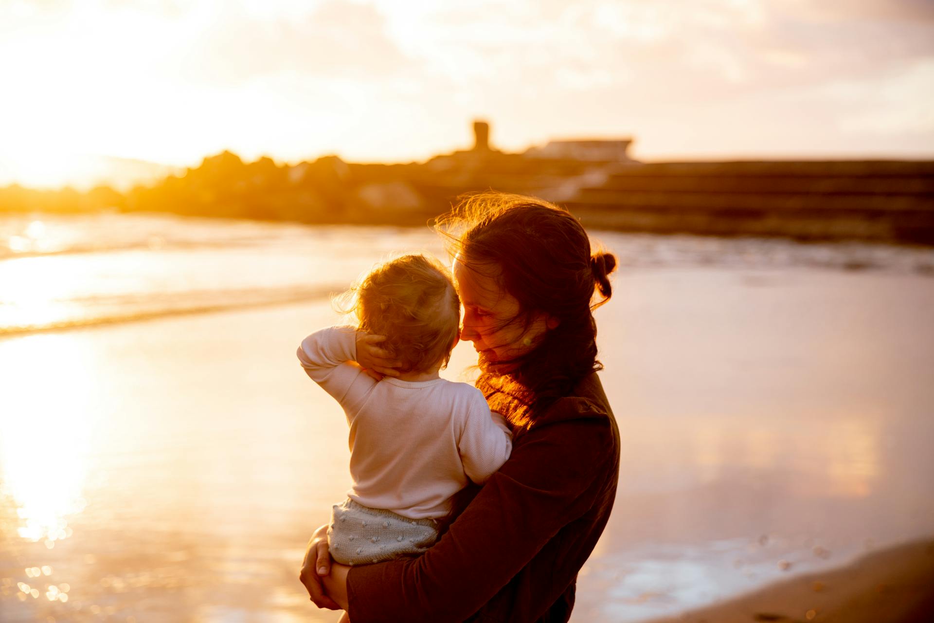 A woman holding her baby | Source: Pexels