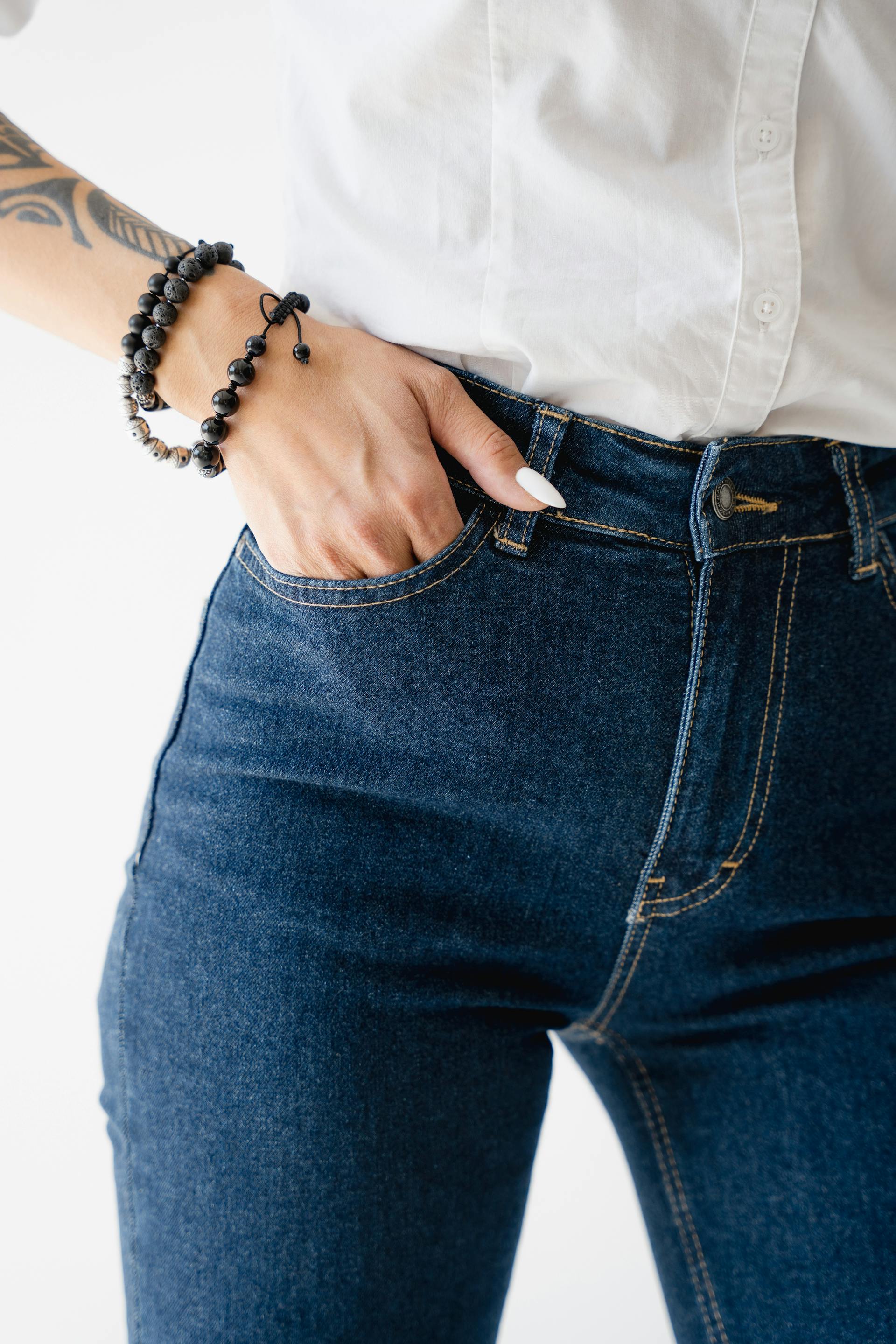 A woman with her hand in her pocket | Source: Midjourney