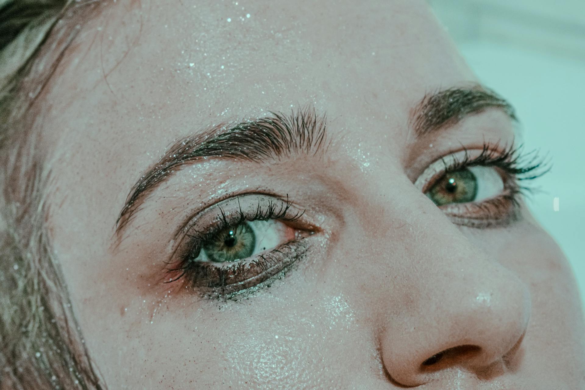 A woman's face with smudged makeup | Source: Pexels