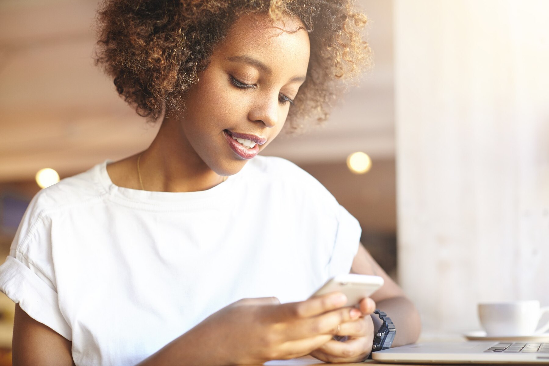 A woman typing on her phone | Source: Freepik