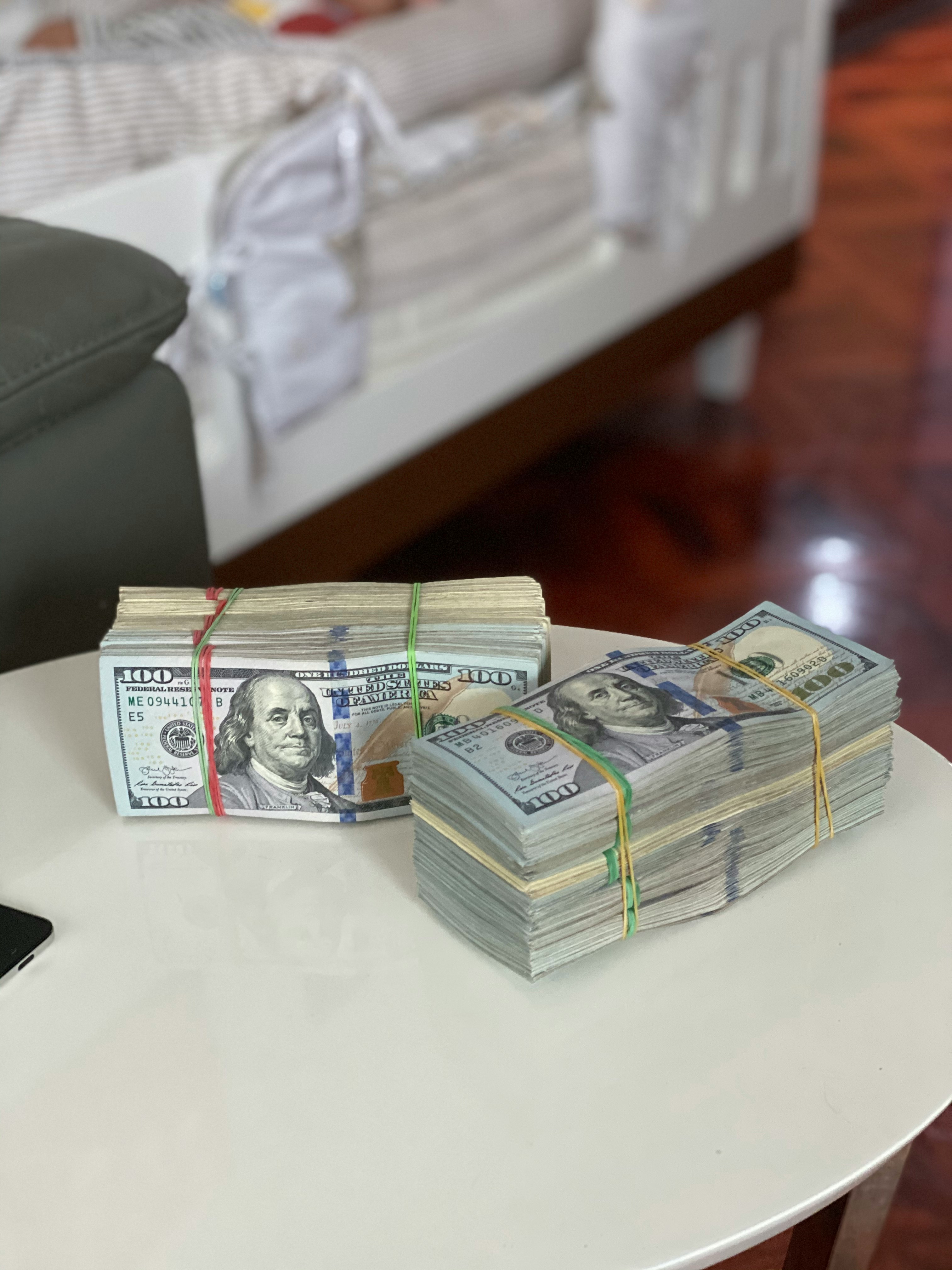Stacks of money on a table | Source: Unsplash