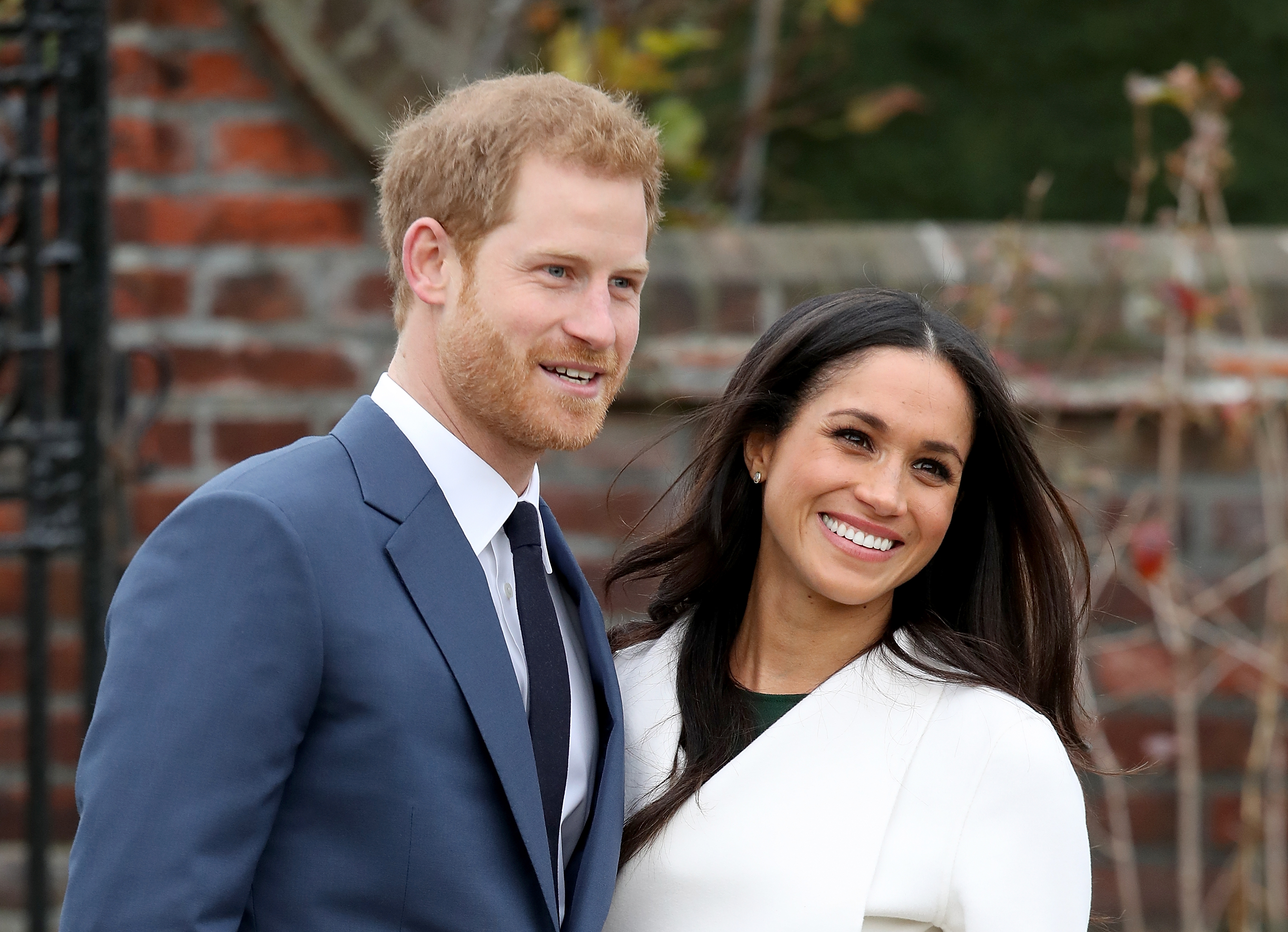 Prince Harry and actress Meghan Markle during an official photocall to announce their engagement at The Sunken Gardens at Kensington Palace on November 27, 2017 in London, England. | Source: Getty Images