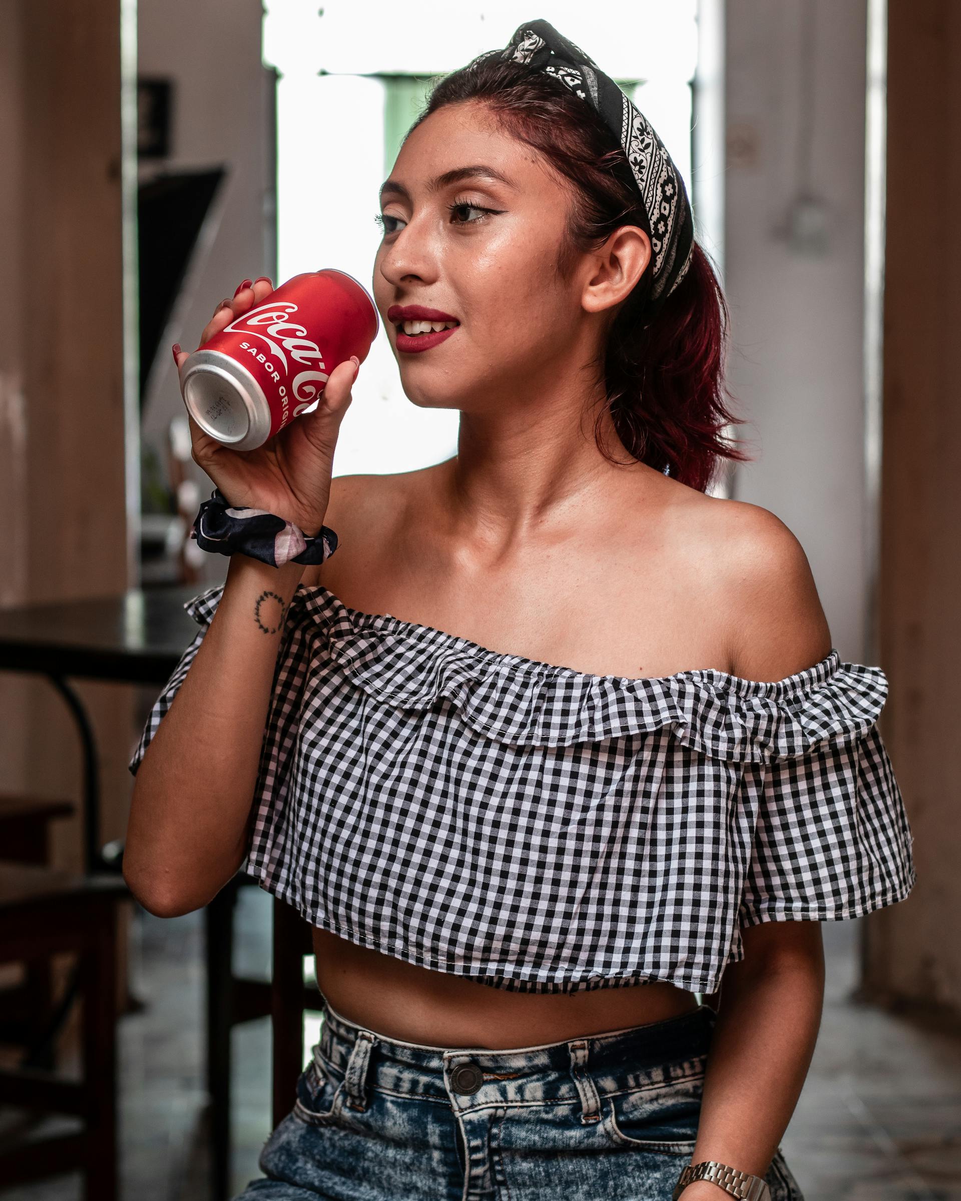 A woman drinking soda | Source: Pexels