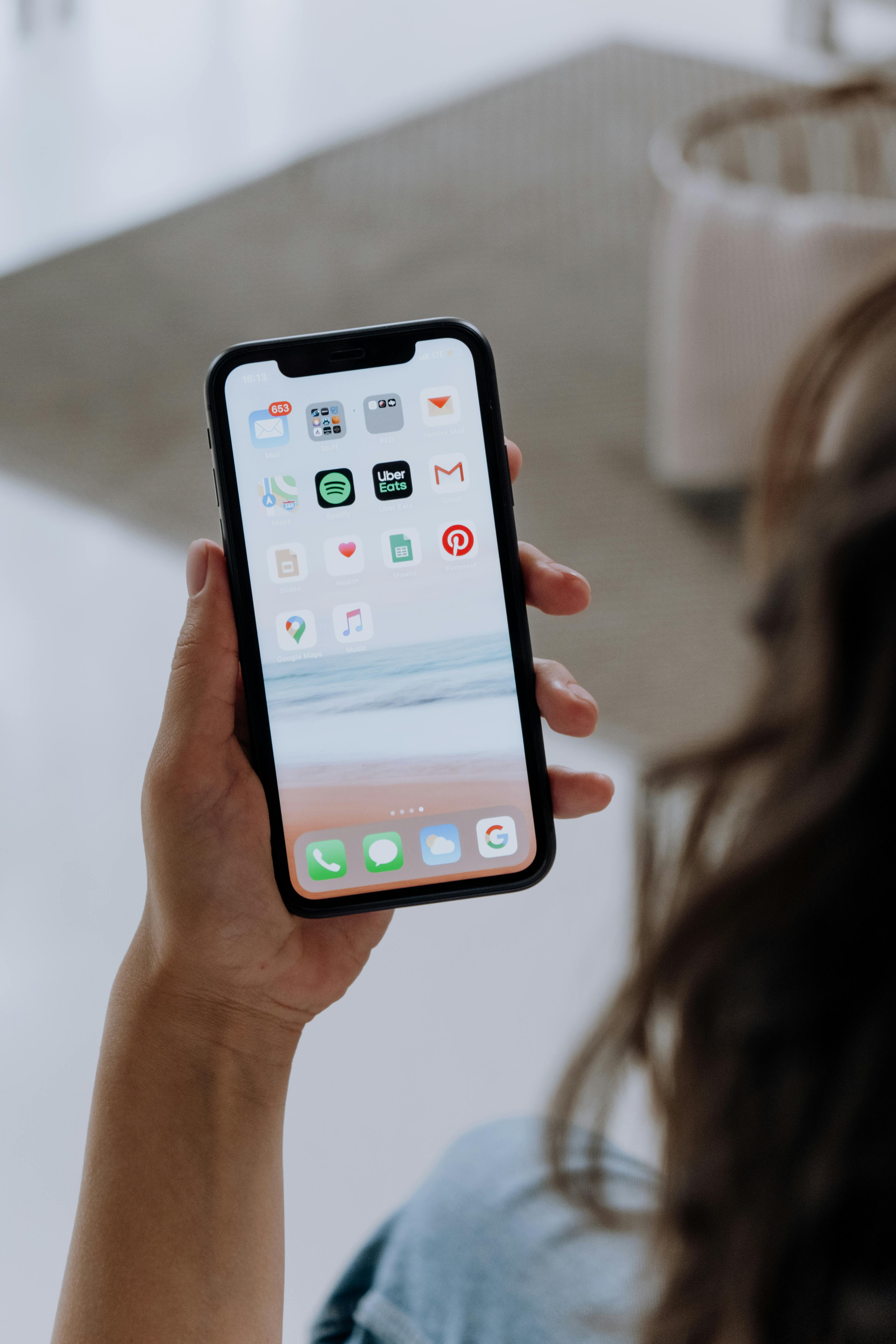 A woman going through a phone | Source: Pexels