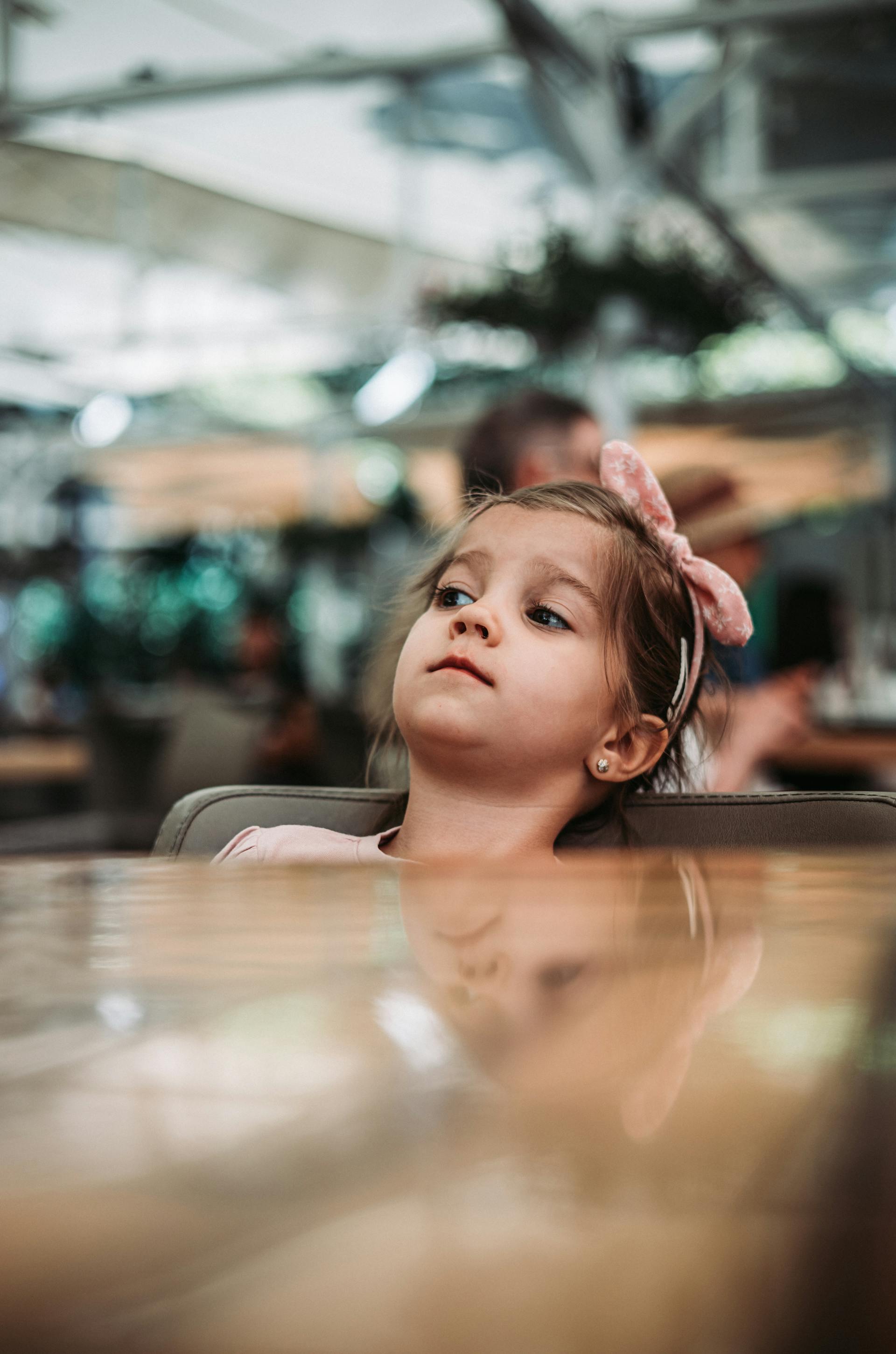 A child seated at a dinner table | Source: Pexels
