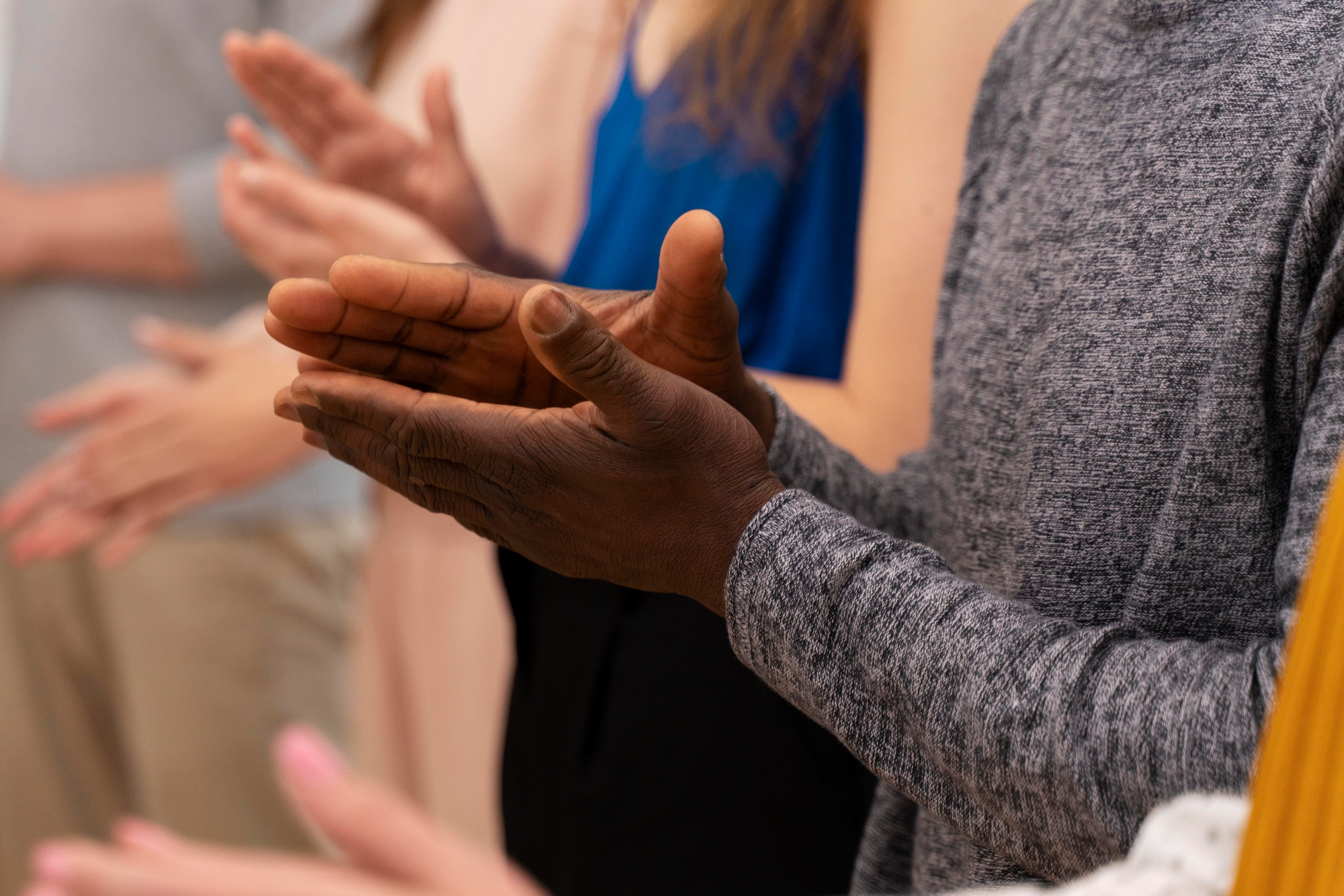 People clapping | Source: Freepik
