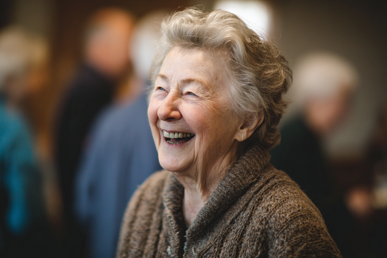 An older woman laughing | Source: Midjourney
