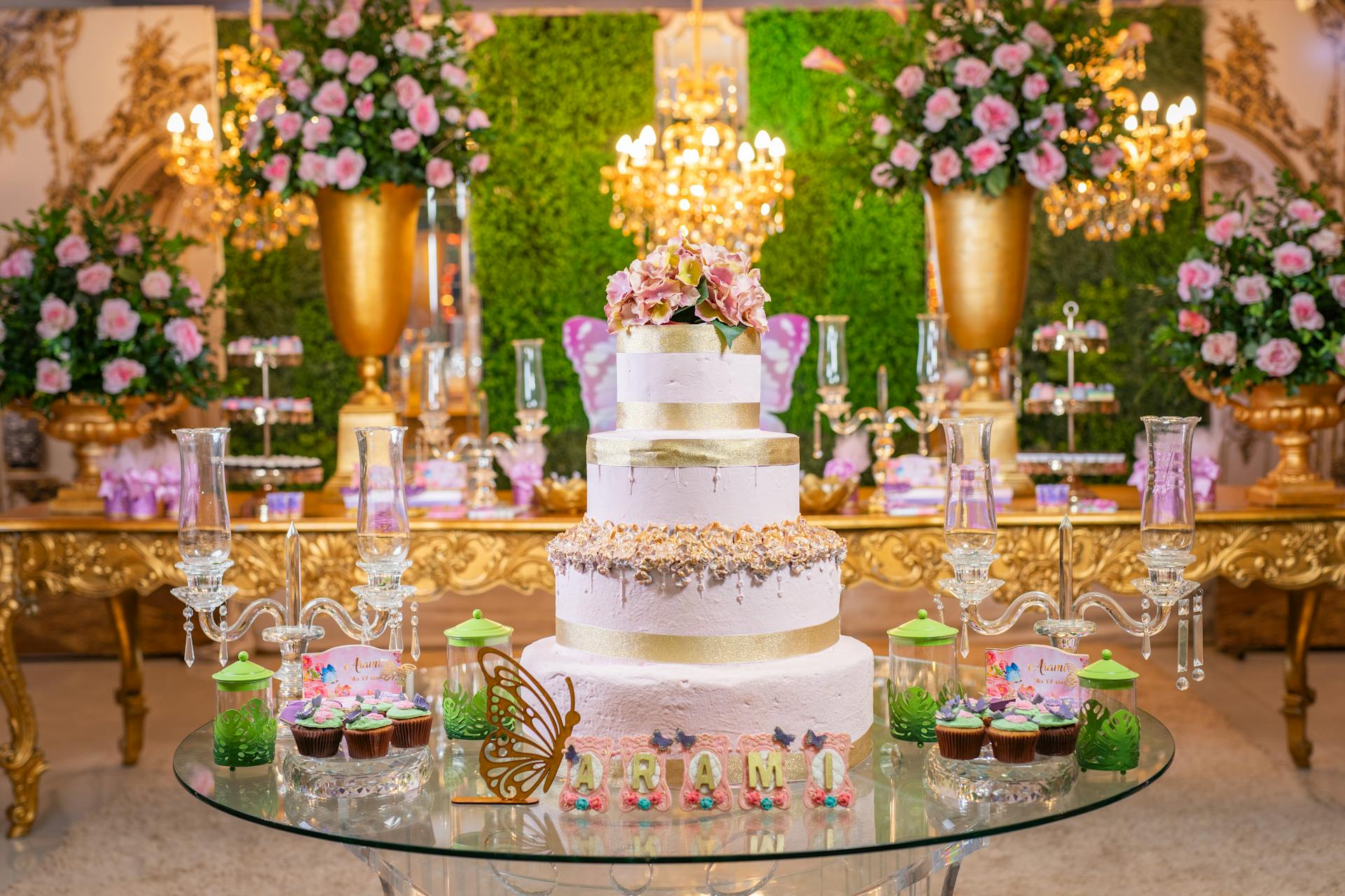 A photo showing flower arrangements and a birthday cake at a venue | Source: Pexels