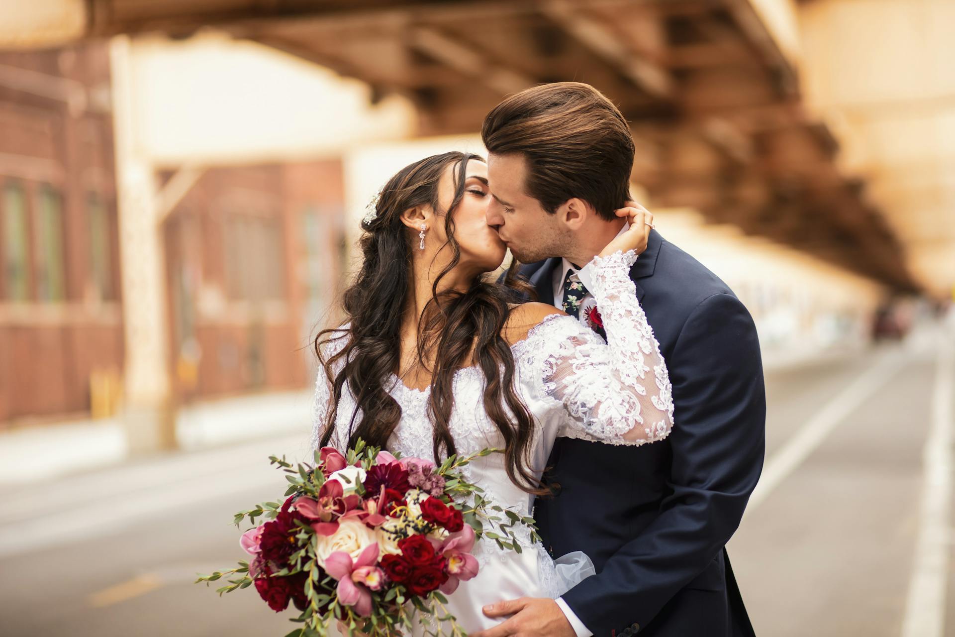 A newlywed couple sealing their love with a kiss | Source: Pexels