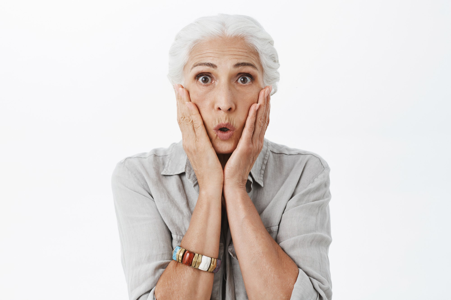 A shaken senior woman | Source: Freepik
