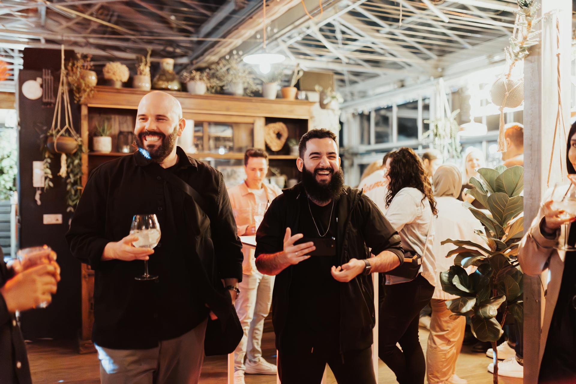 Men laughing at a party | Source: Pexels