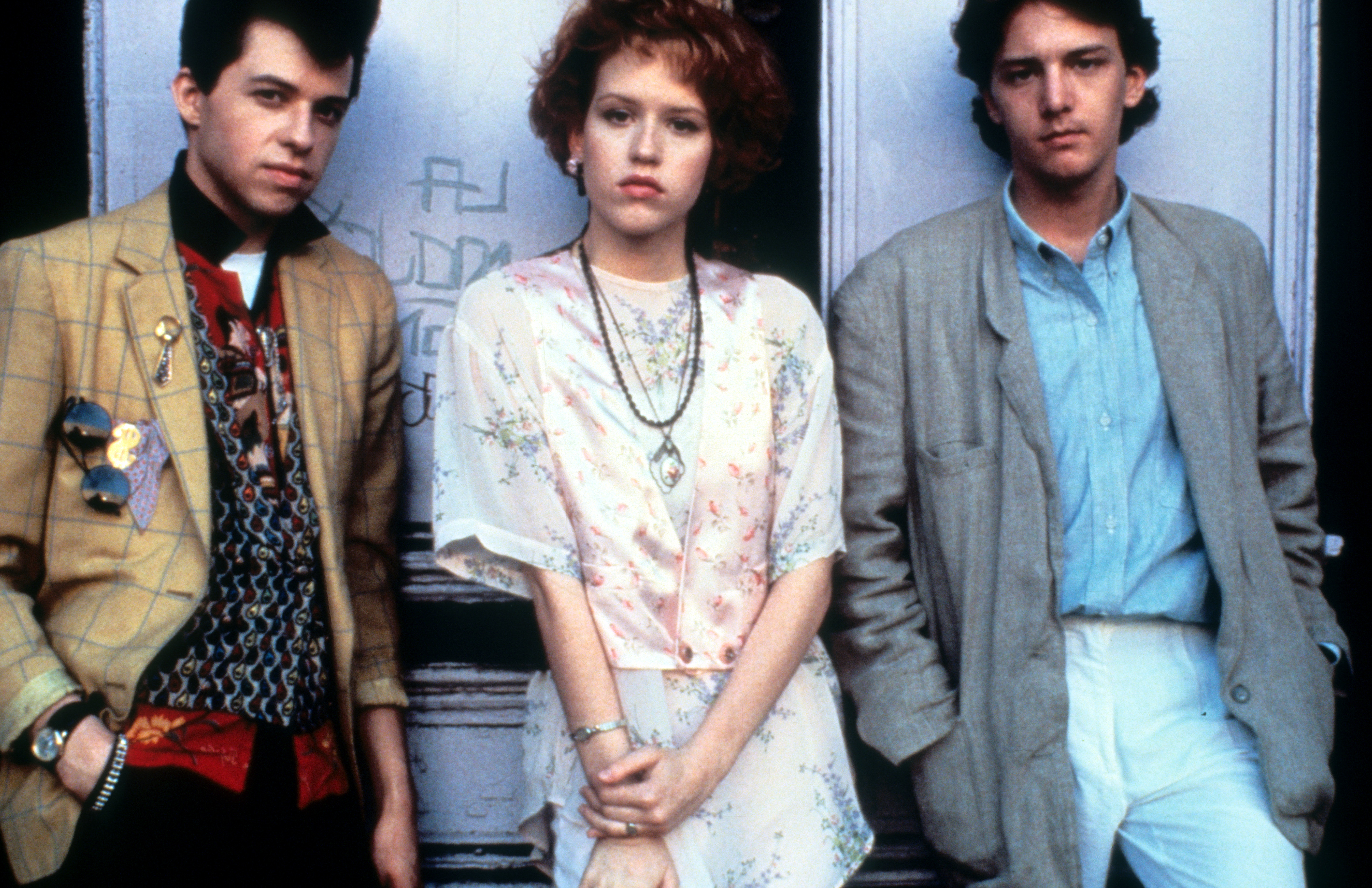Jon Cryer, Molly Ringwald and Andrew McCarthy on set of the film "Pretty In Pink," 1986 | Source: Getty Images