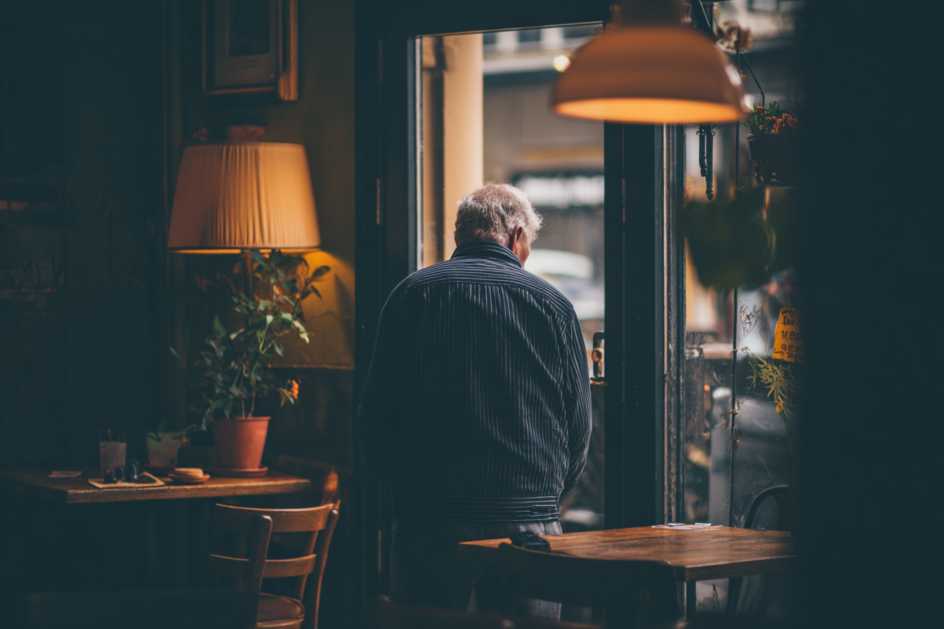 A man in a café | Source: Midjourney