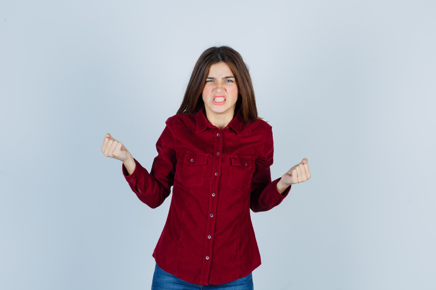 An angry young woman | Source: Freepik