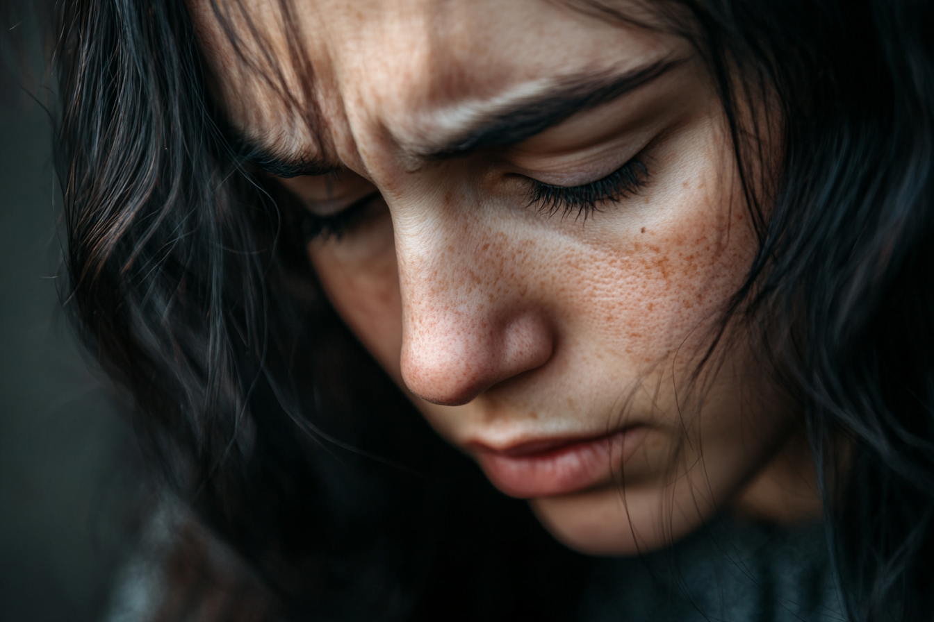 Close up of a heartbroken woman's face | Source: Midjourney