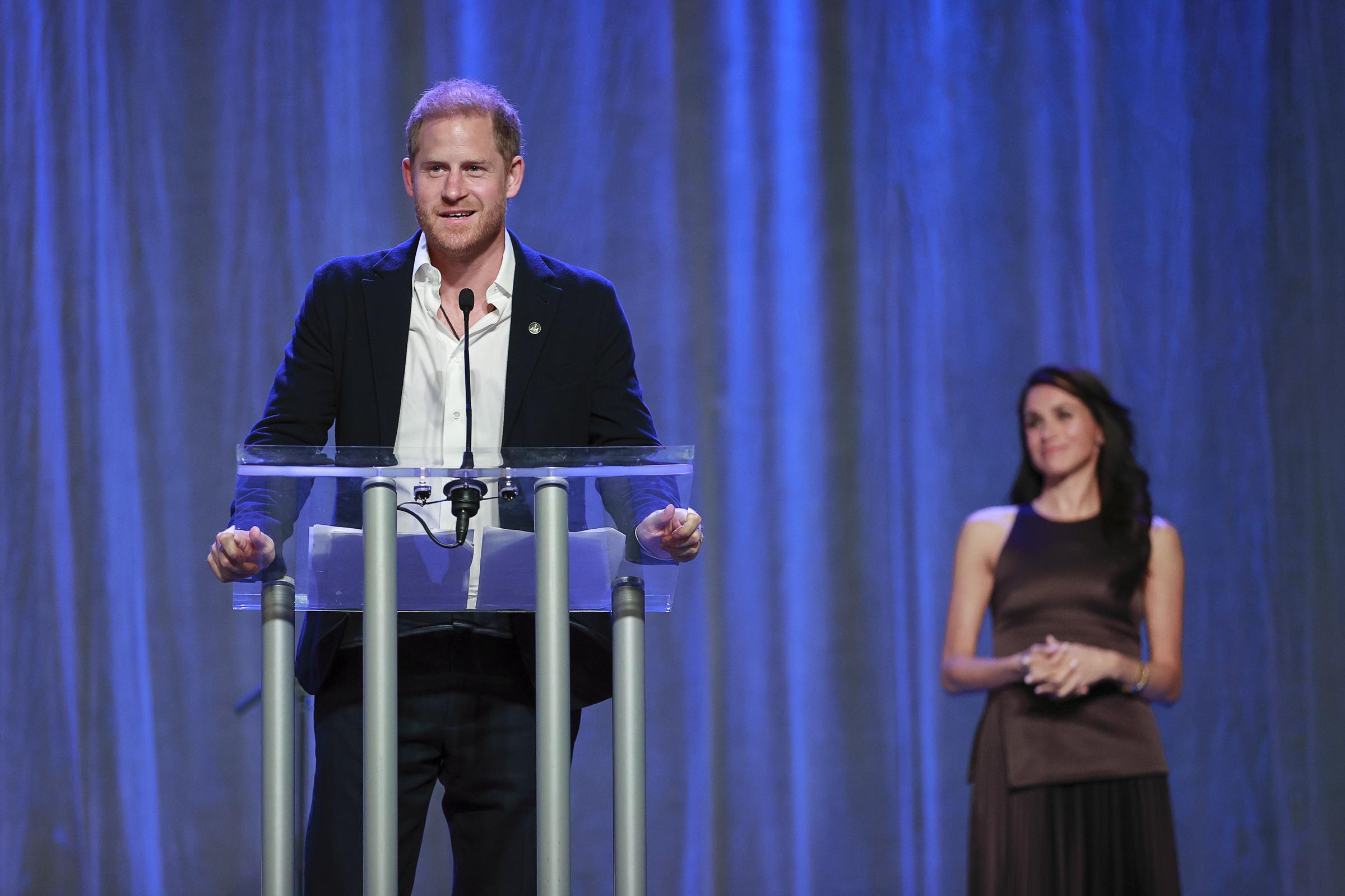 Prince Harry and Meghan Markle onstage while the Duke delivered remarks at the Invictus Games Vancouver Whistler 2025 Nation Home Welcome Reception on February 7, 2025, in Canada. | Source: Getty Images