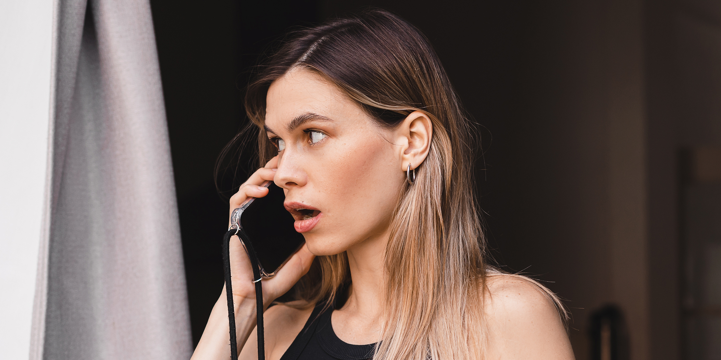 A woman talking on the phone | Source: Shutterstock