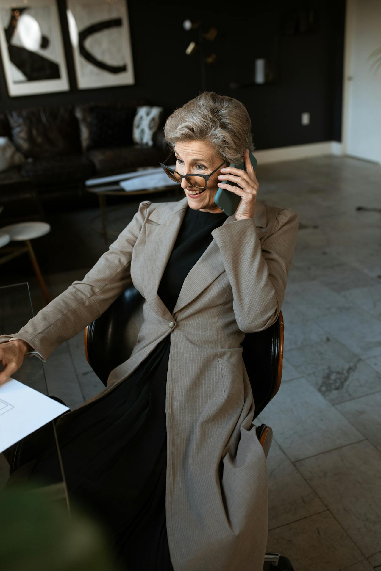 An elegant older woman talking on the phone | Source: Pexels