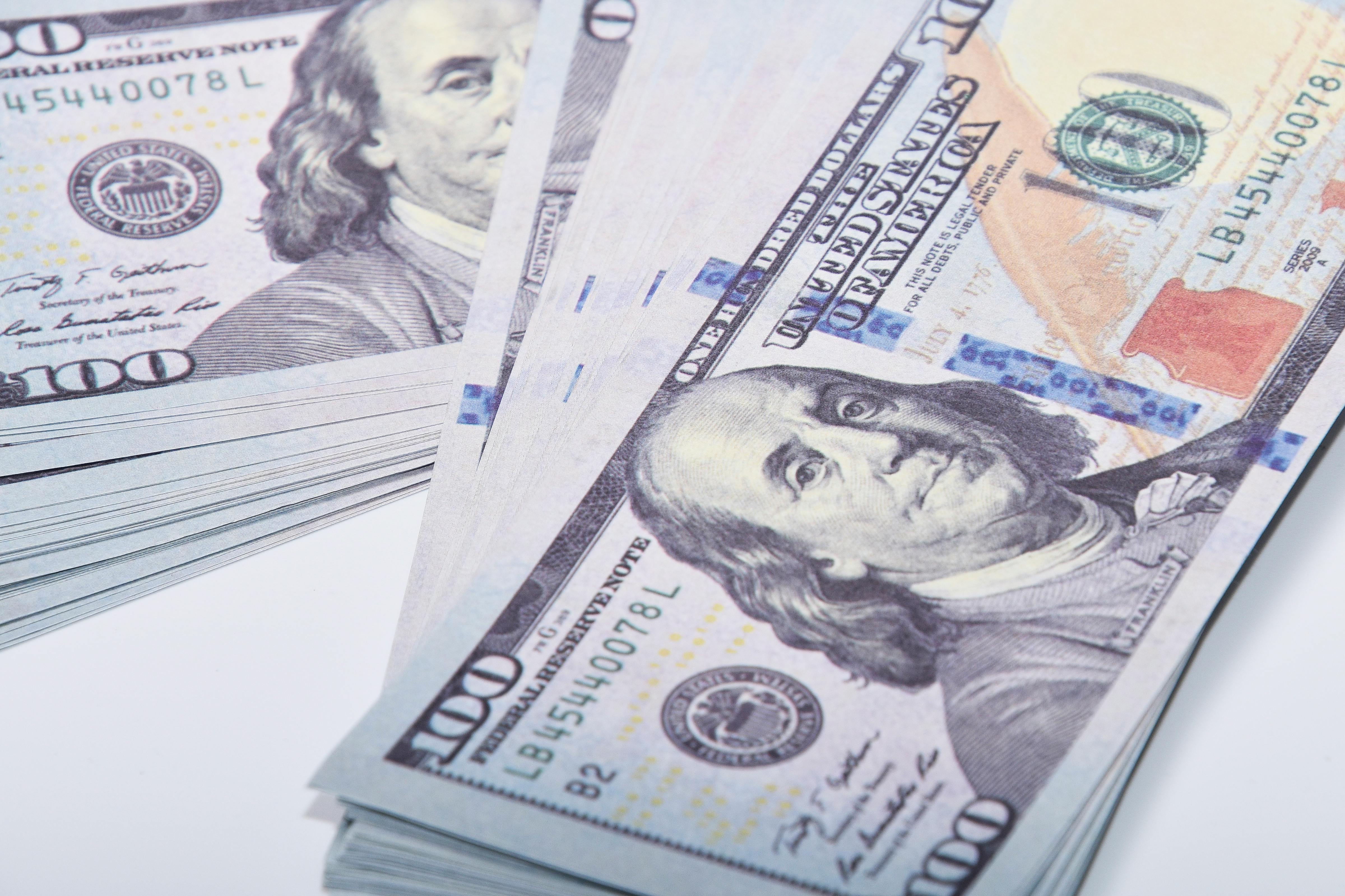 A close up of money on a table | Source: Pexels