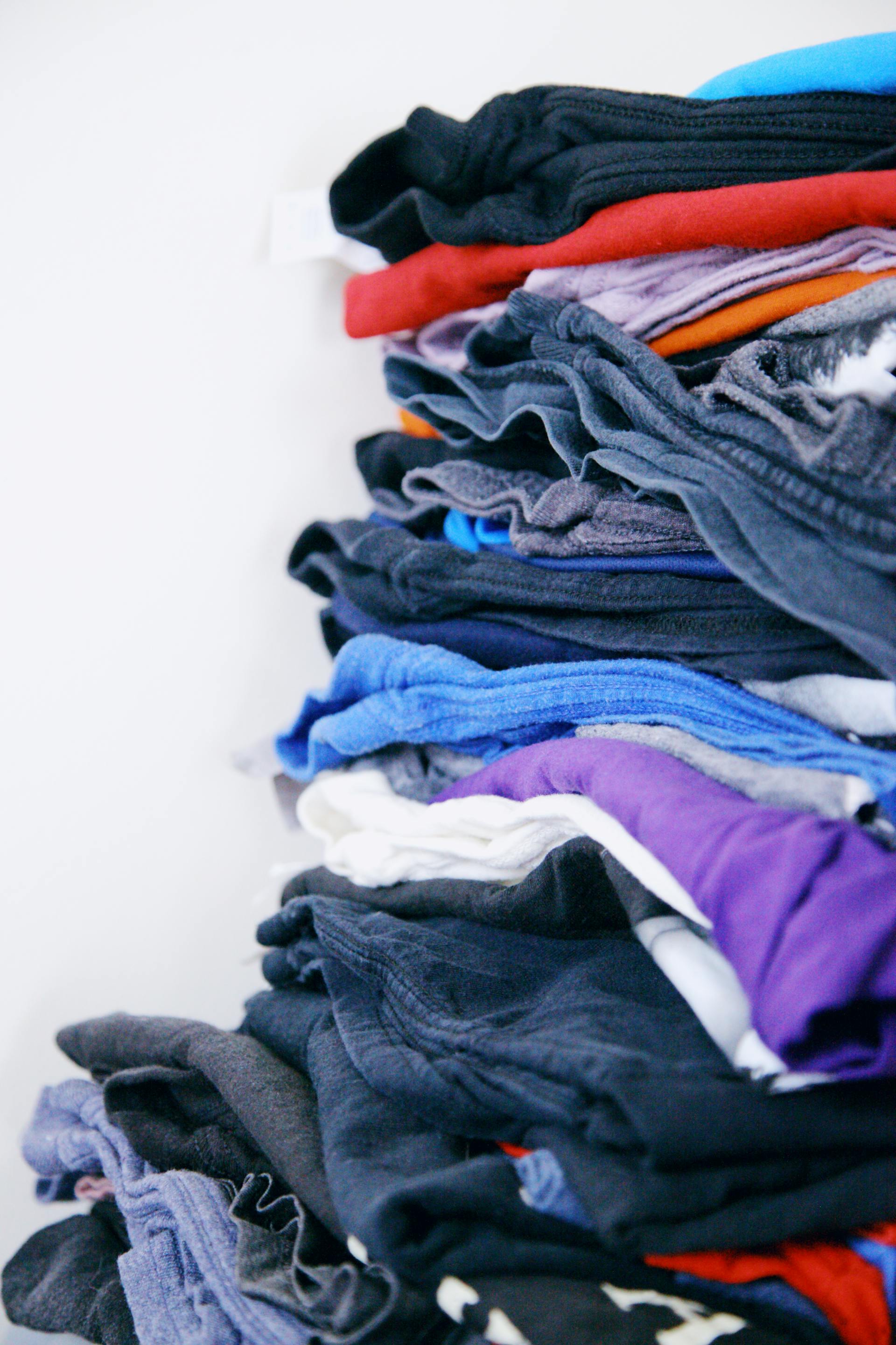 A close-up photo of folded clothes | Source: Pexels