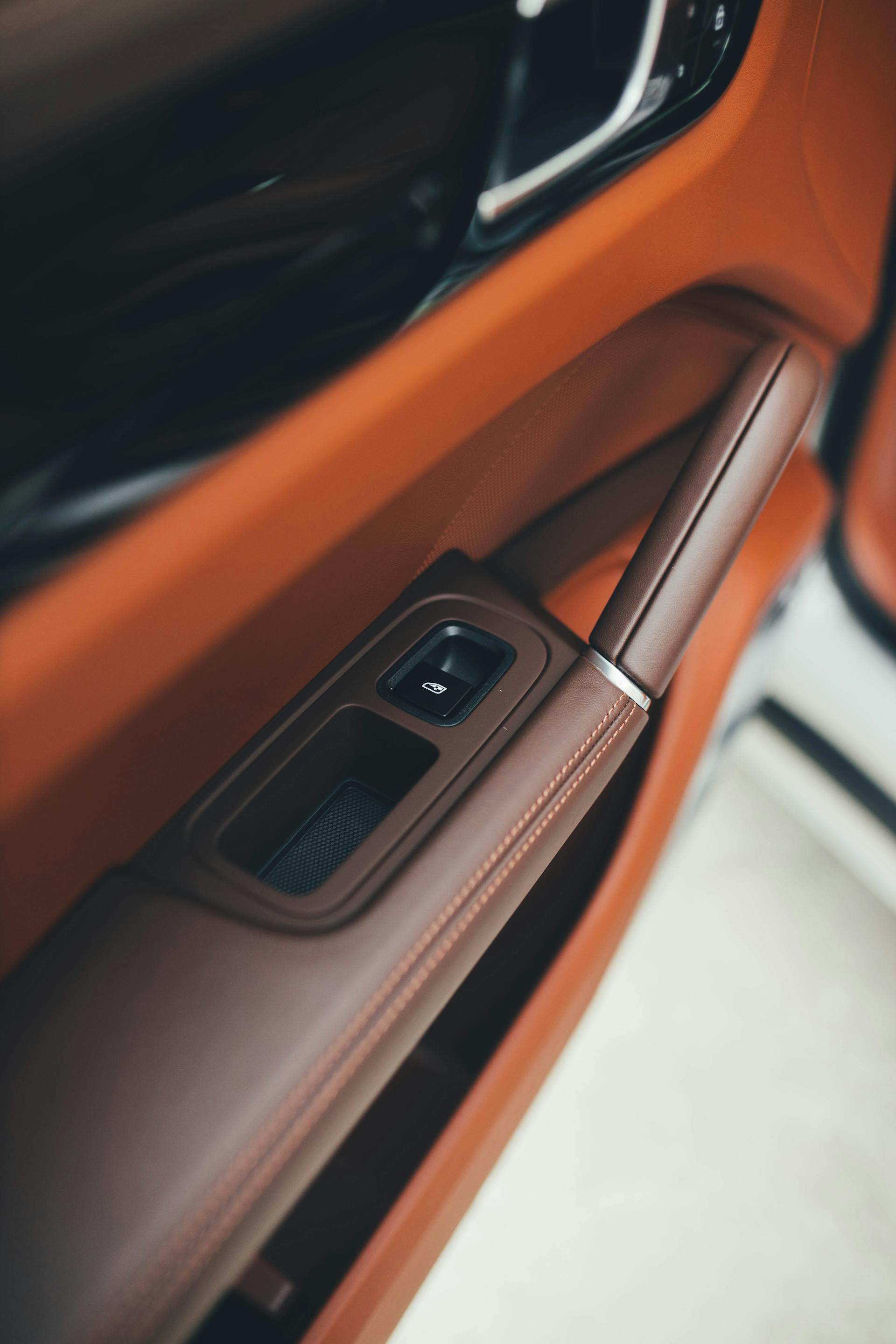 A window button in a luxury car | Source: Pexels