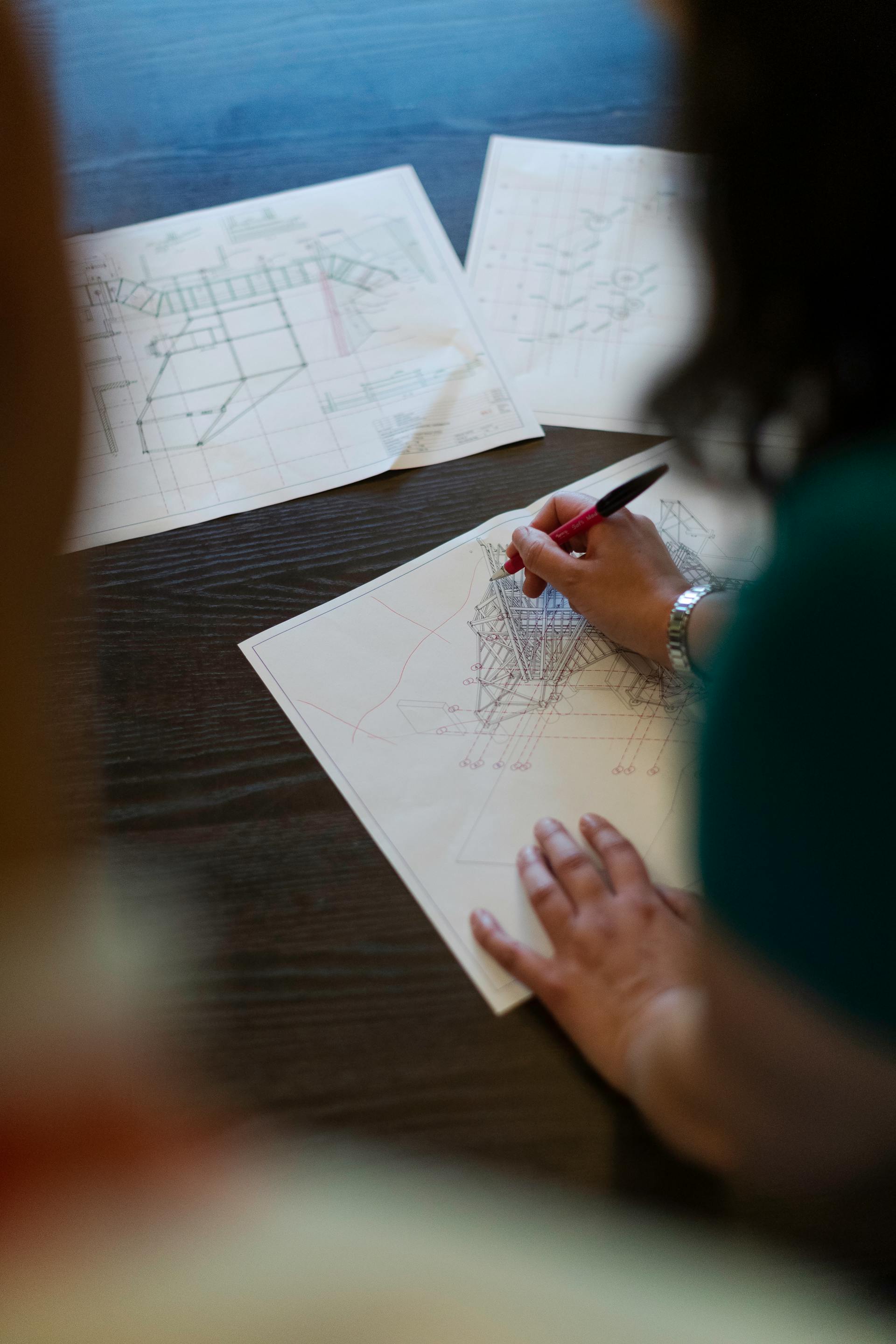 People working on a blueprint | Source: Pexels