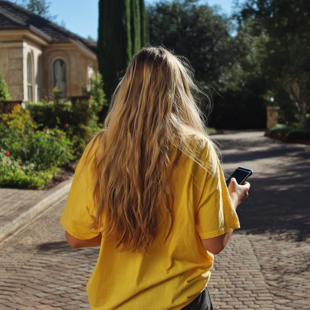 A woman walking outside | Source: Midjourney